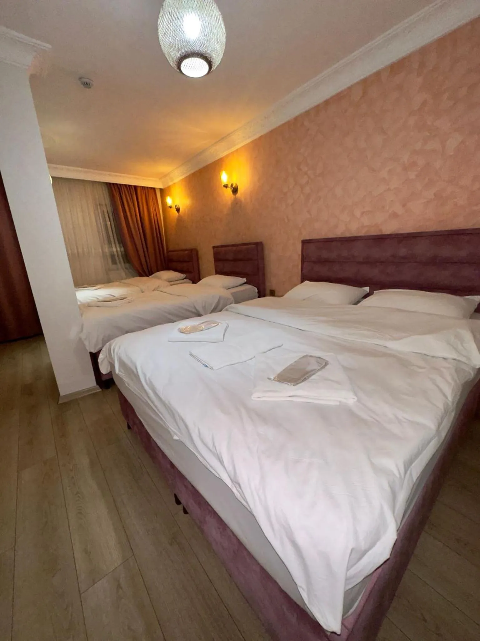 Bed in AVRASYAQUEEN HOTEL