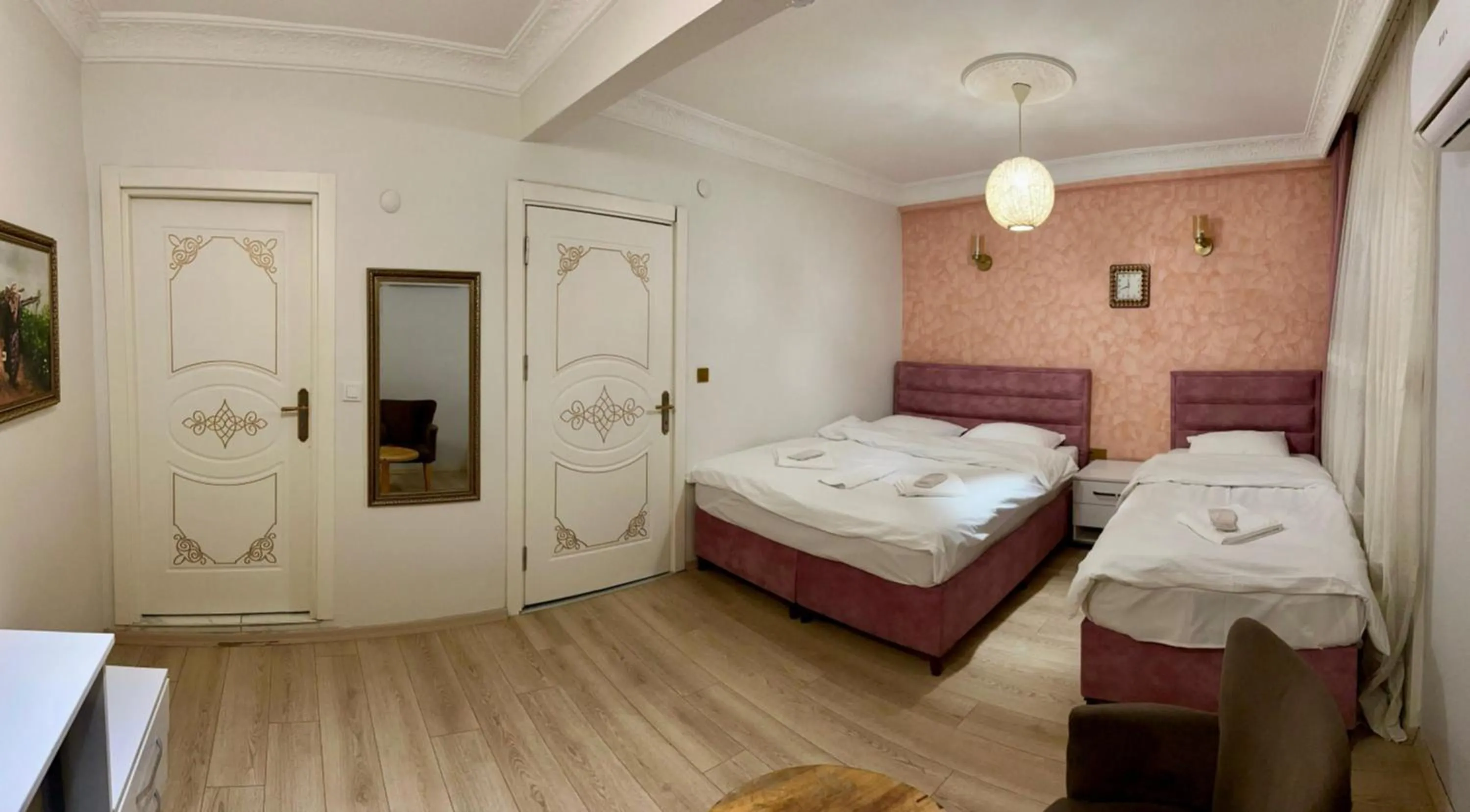 Bed in AVRASYAQUEEN HOTEL