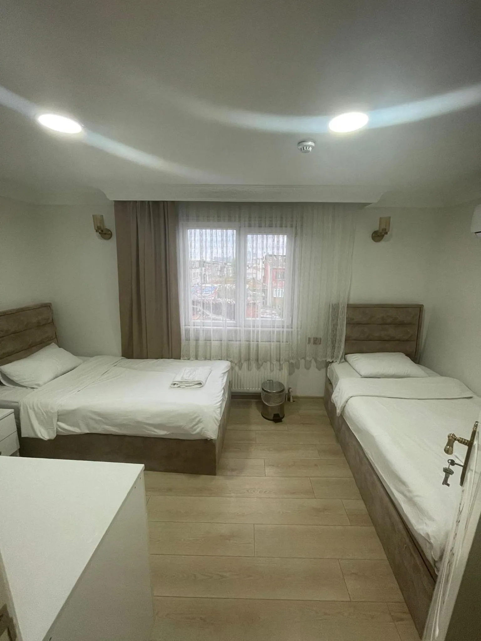 Bed in AVRASYAQUEEN HOTEL