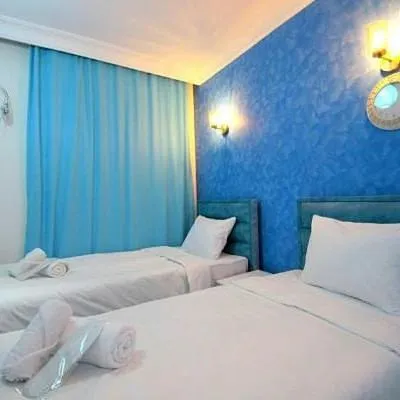 Bed in AVRASYAQUEEN HOTEL