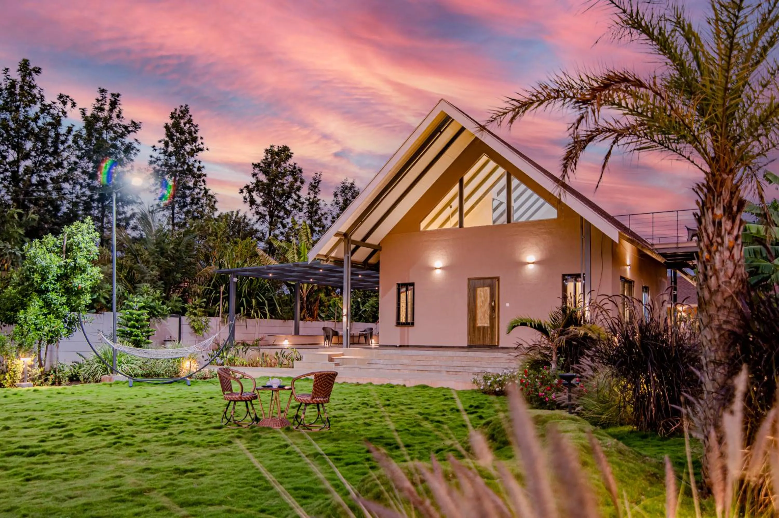 Property building in SaffronStays Eden - 3BR vineyard-side pool villa with jacuzzi, farm dining, stargazing deck & lawns for celebrations