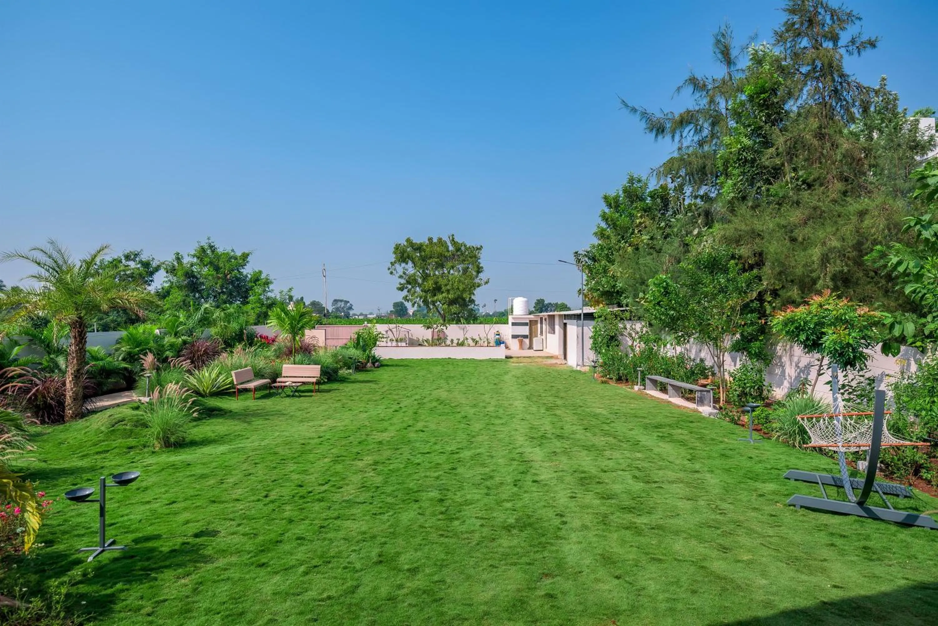 Property building in SaffronStays Eden - 3BR vineyard-side pool villa with jacuzzi, farm dining, stargazing deck & lawns for celebrations