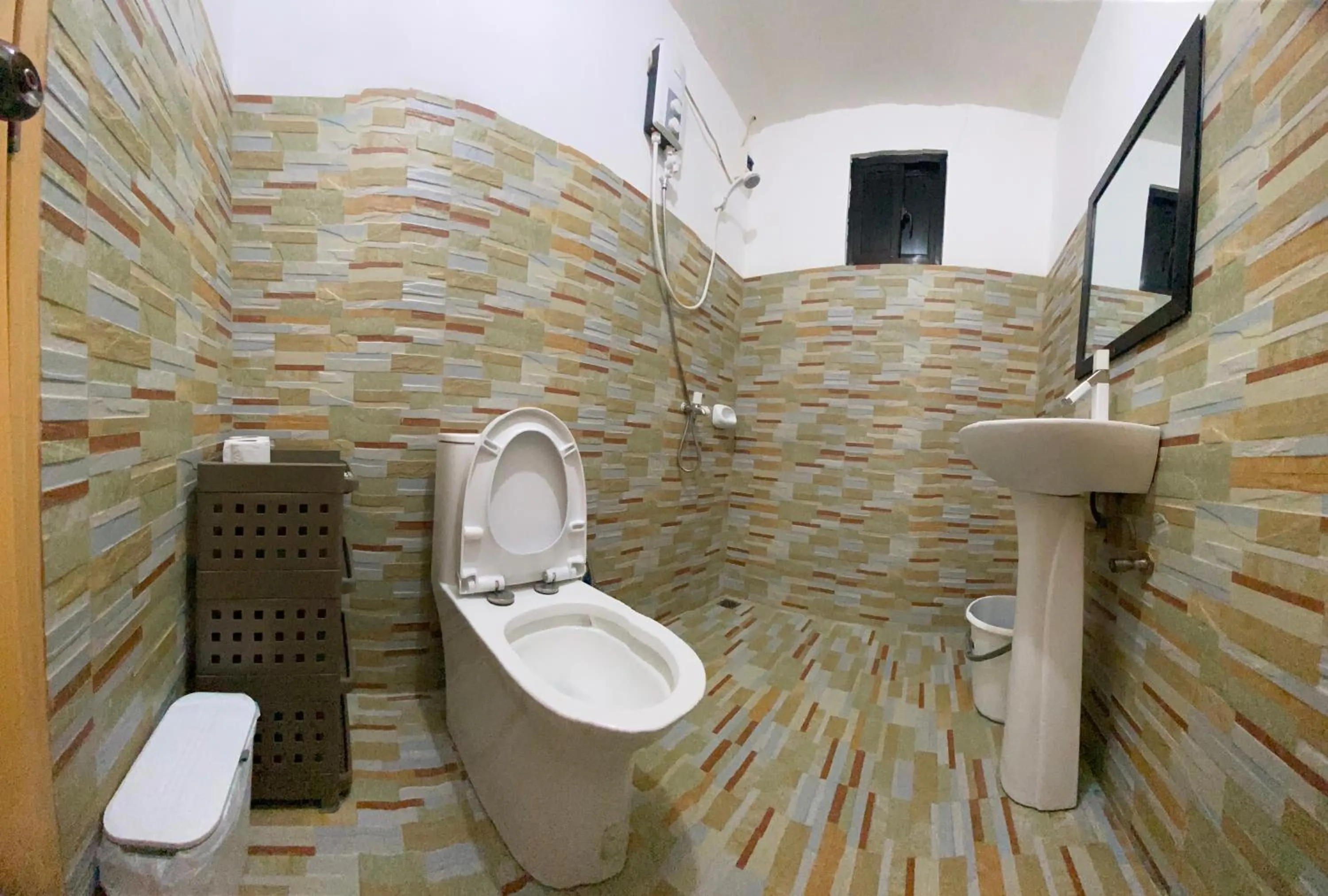 Shower in A&C Aquino Guesthouse