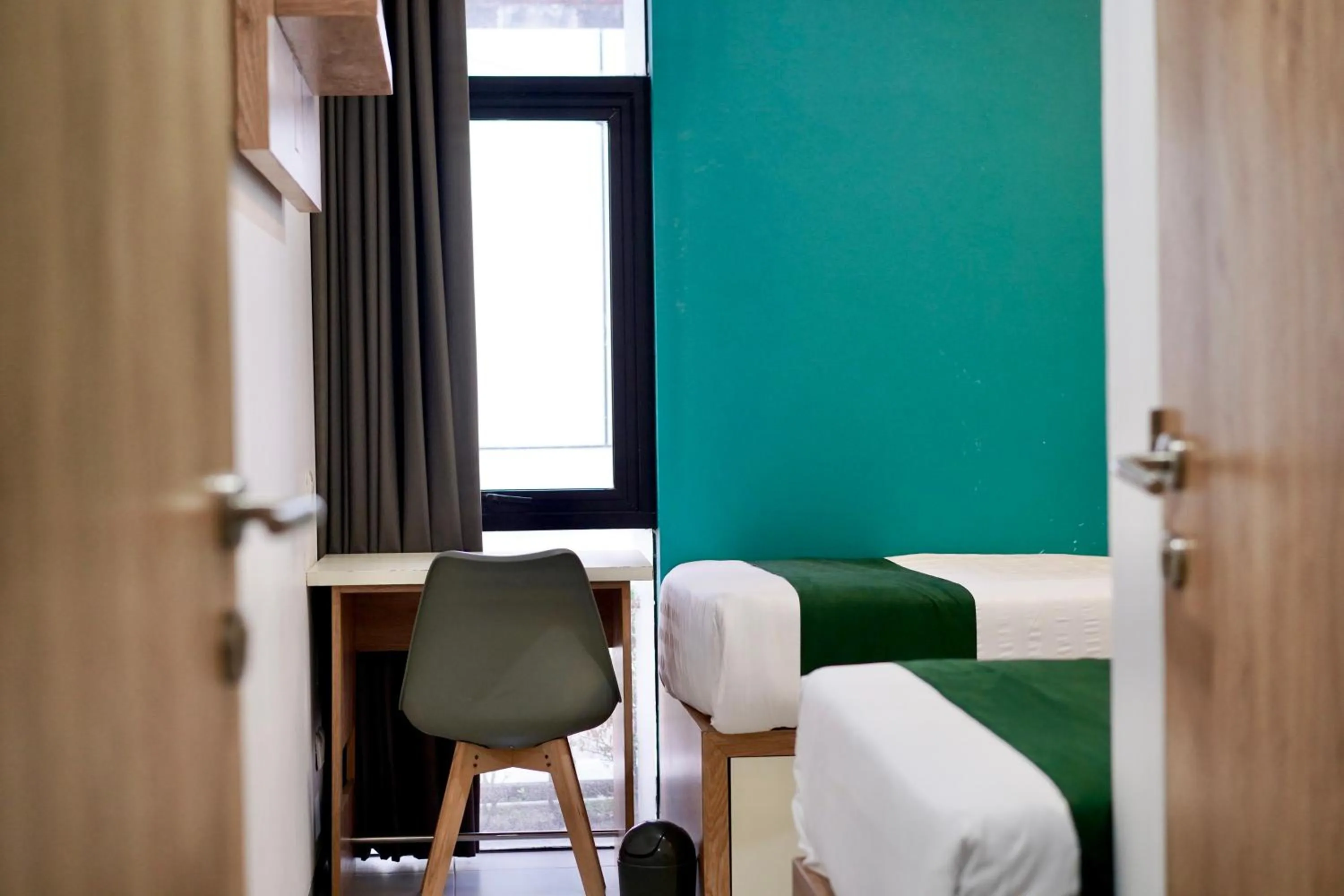 Seating area, Bed in OFO Kost Premium Kampung Inggris Pare Syariah Mitra RedDoorz