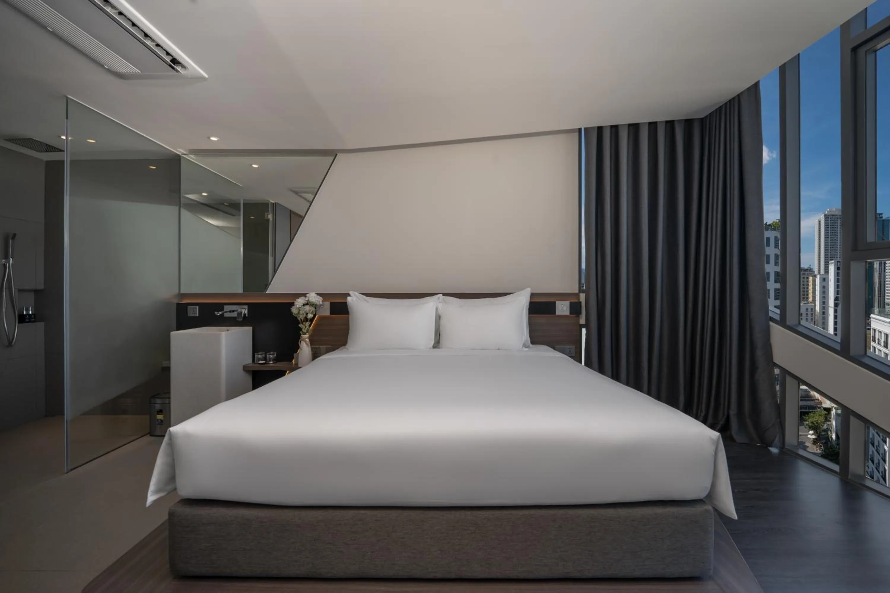 Bed in Draco Hotel & Suites