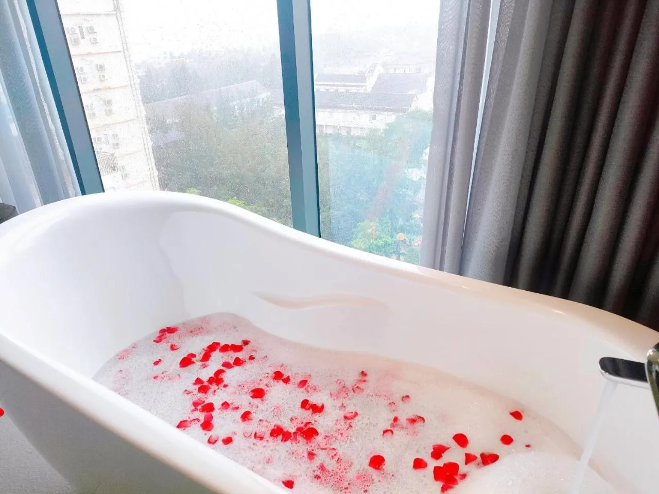 Bathroom in Draco Hotel & Suites