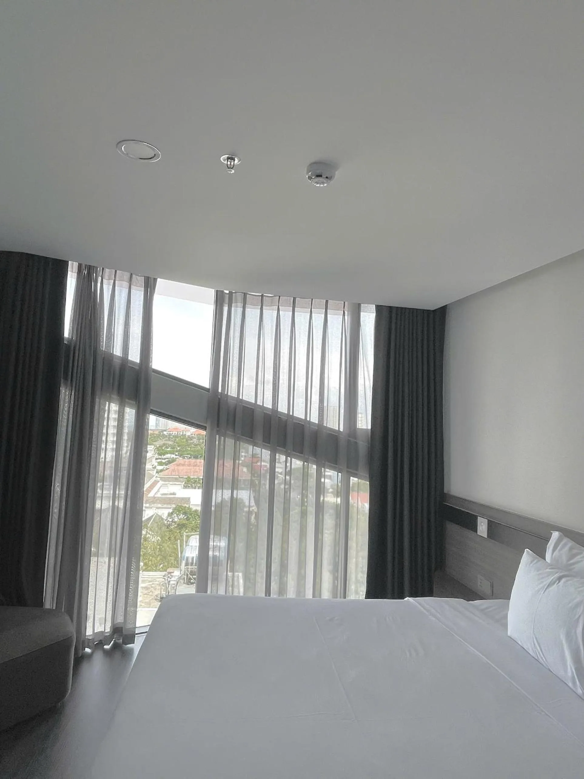 Bed in Draco Hotel & Suites