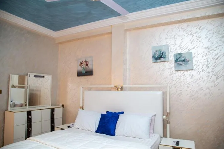 Bed in Macoba Luxury Apartments