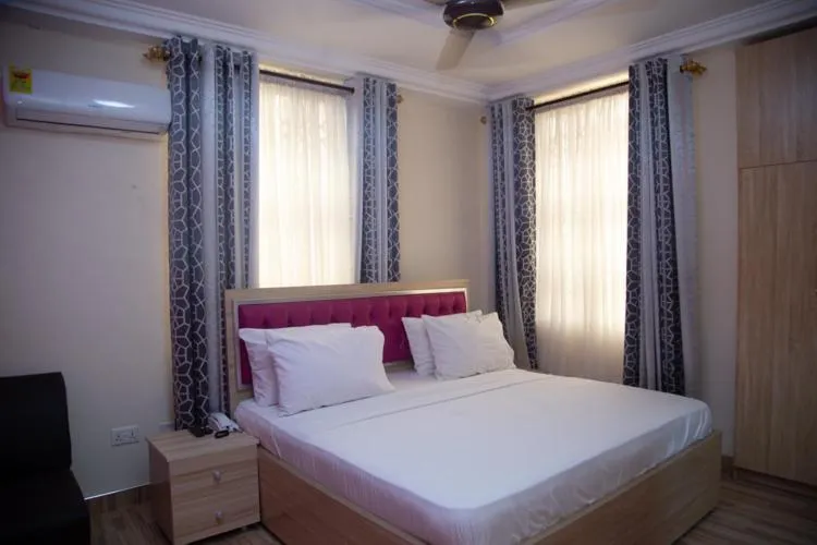 Bed in Macoba Luxury Apartments