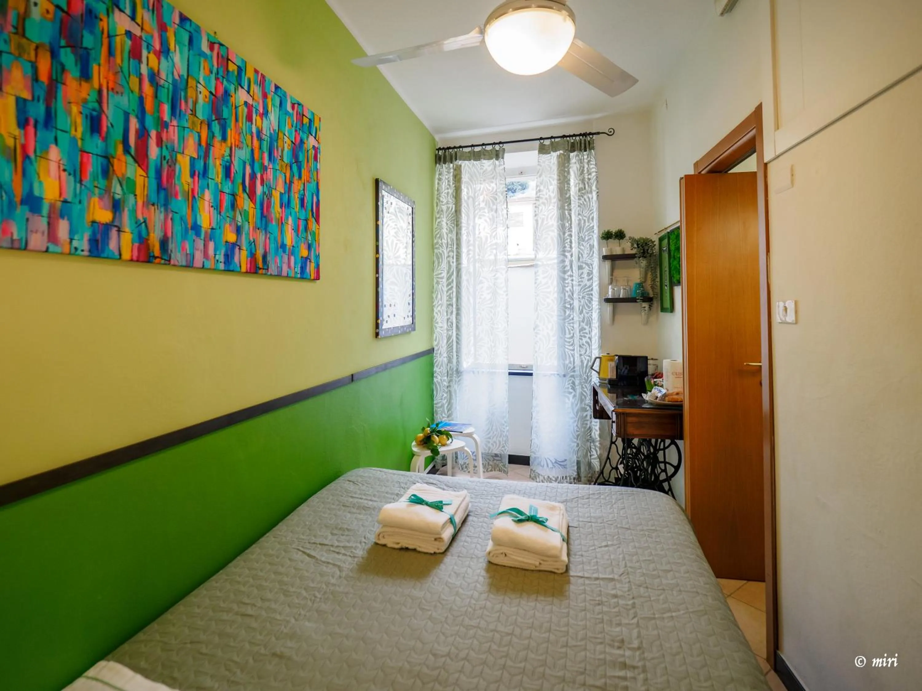 Bed in Carmelina Tiny Village Room