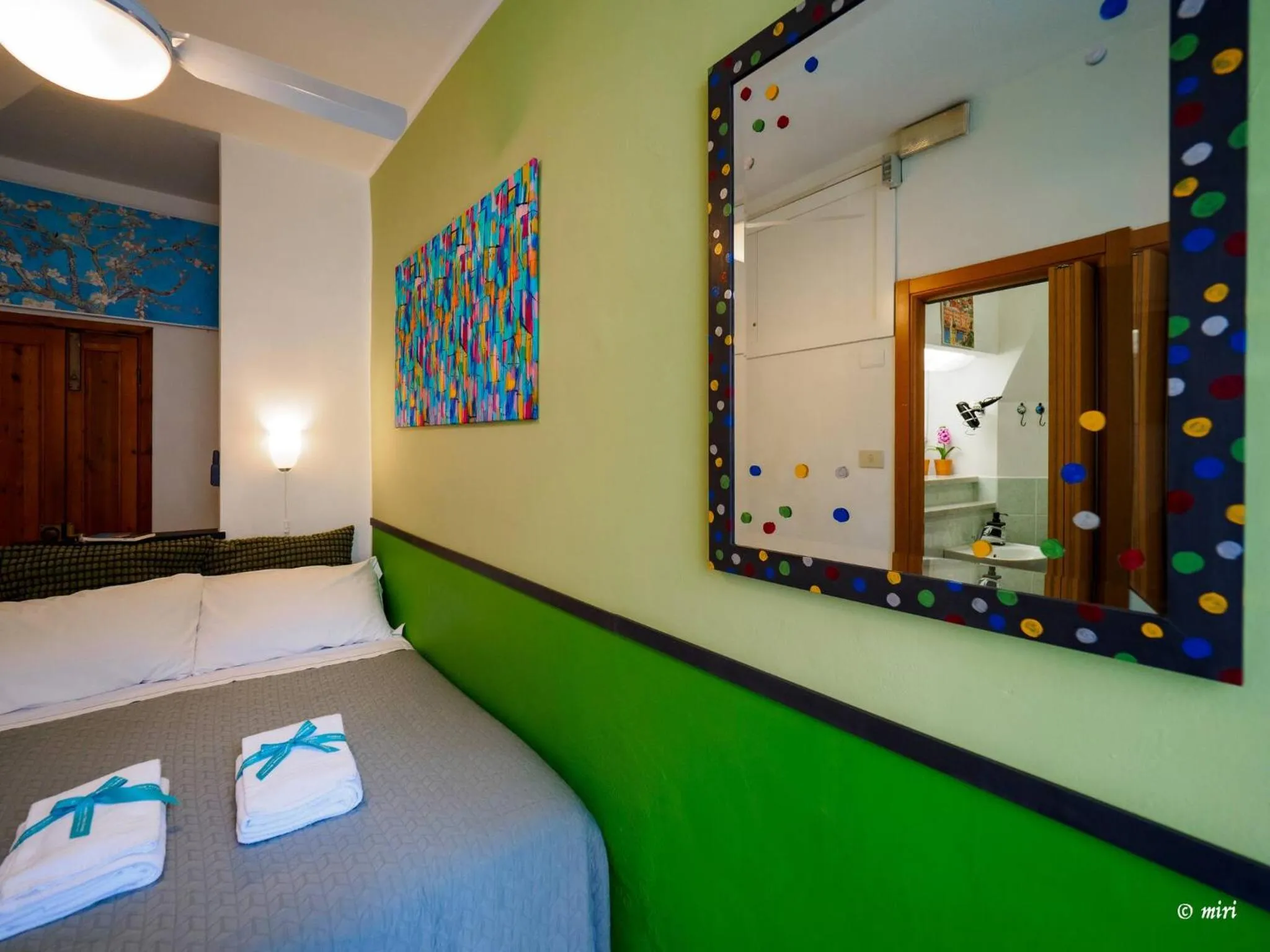 Bed in Carmelina Tiny Village Room