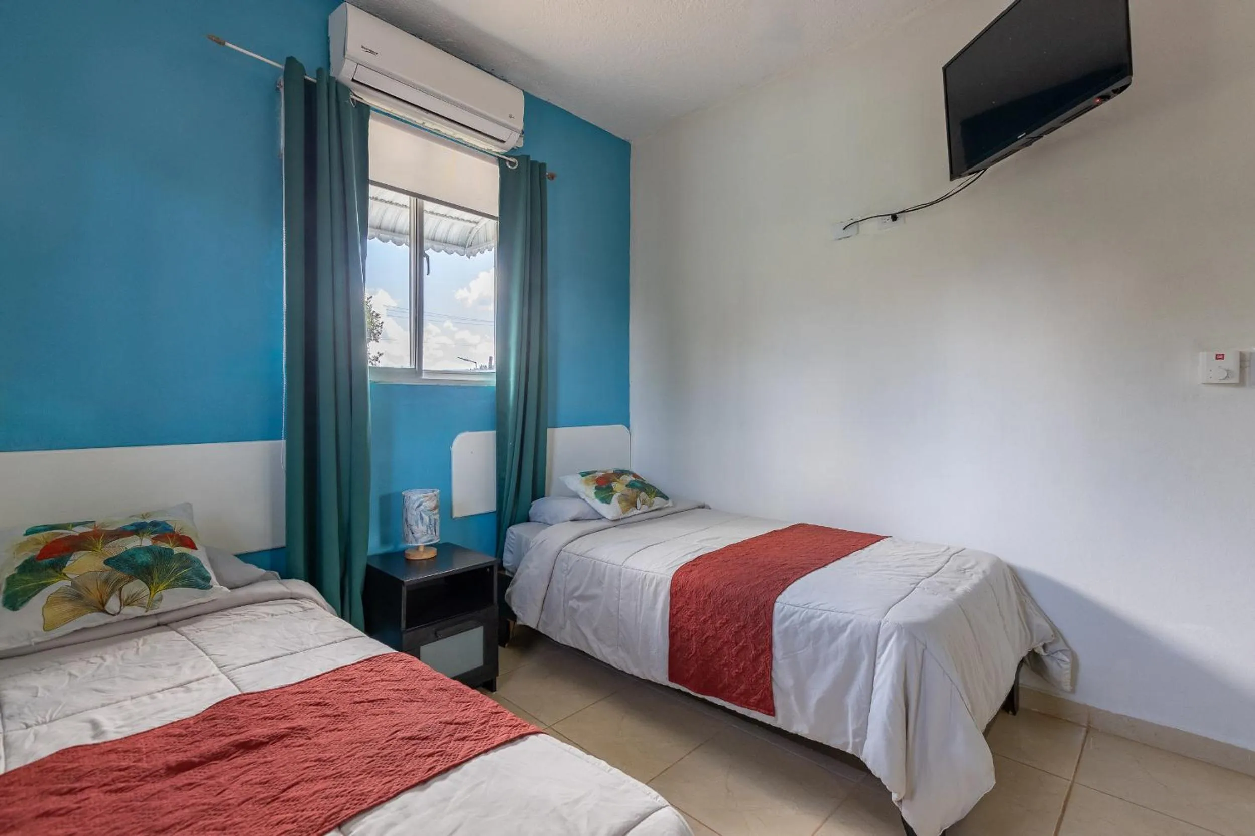 Bed in EDMA APARTAHOTEL