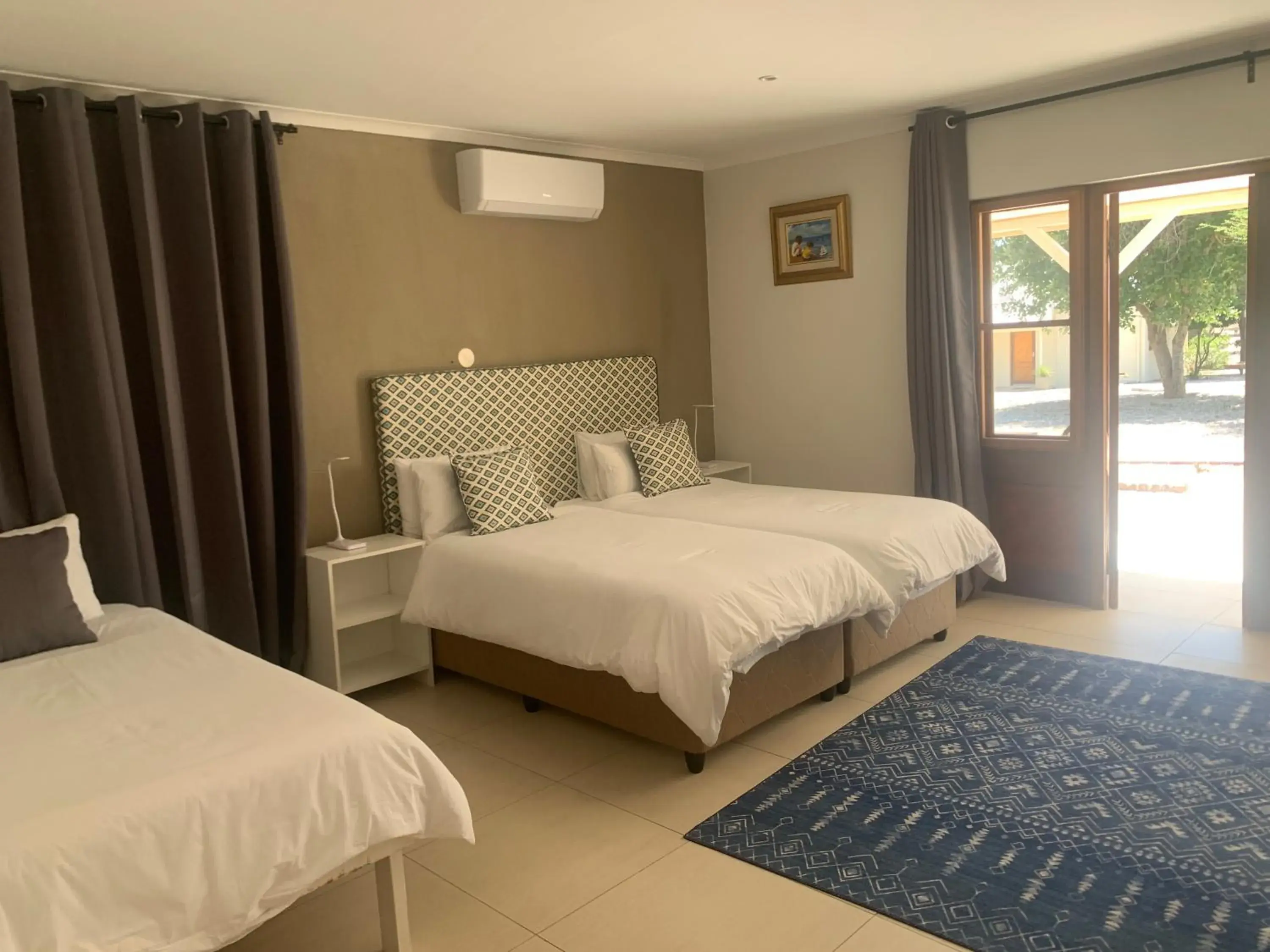 Family triple room in Otjibamba Lodge Family triple room in Otjibamba Lodge