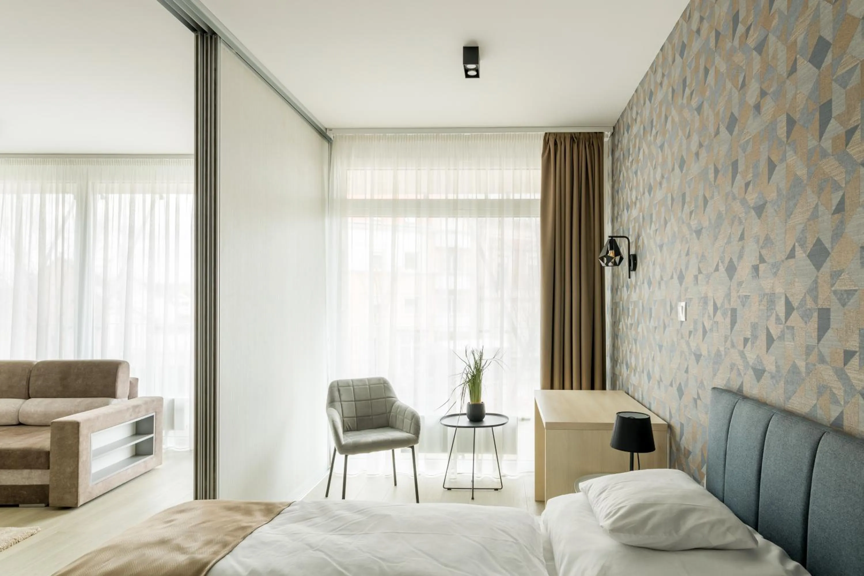 Seating area, Bed in Parizs Garden Apartments