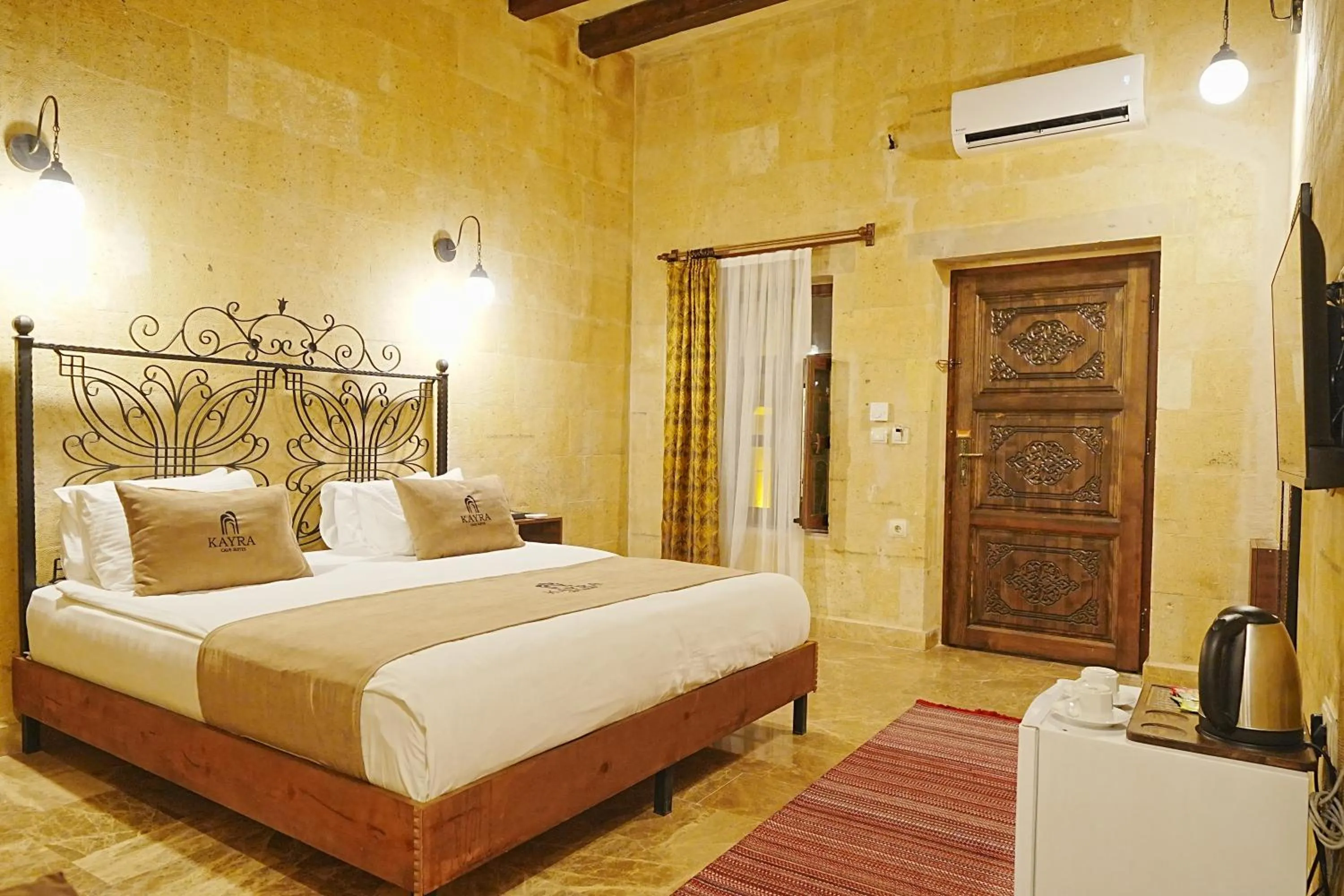 Bed in Kayra Cave Suites