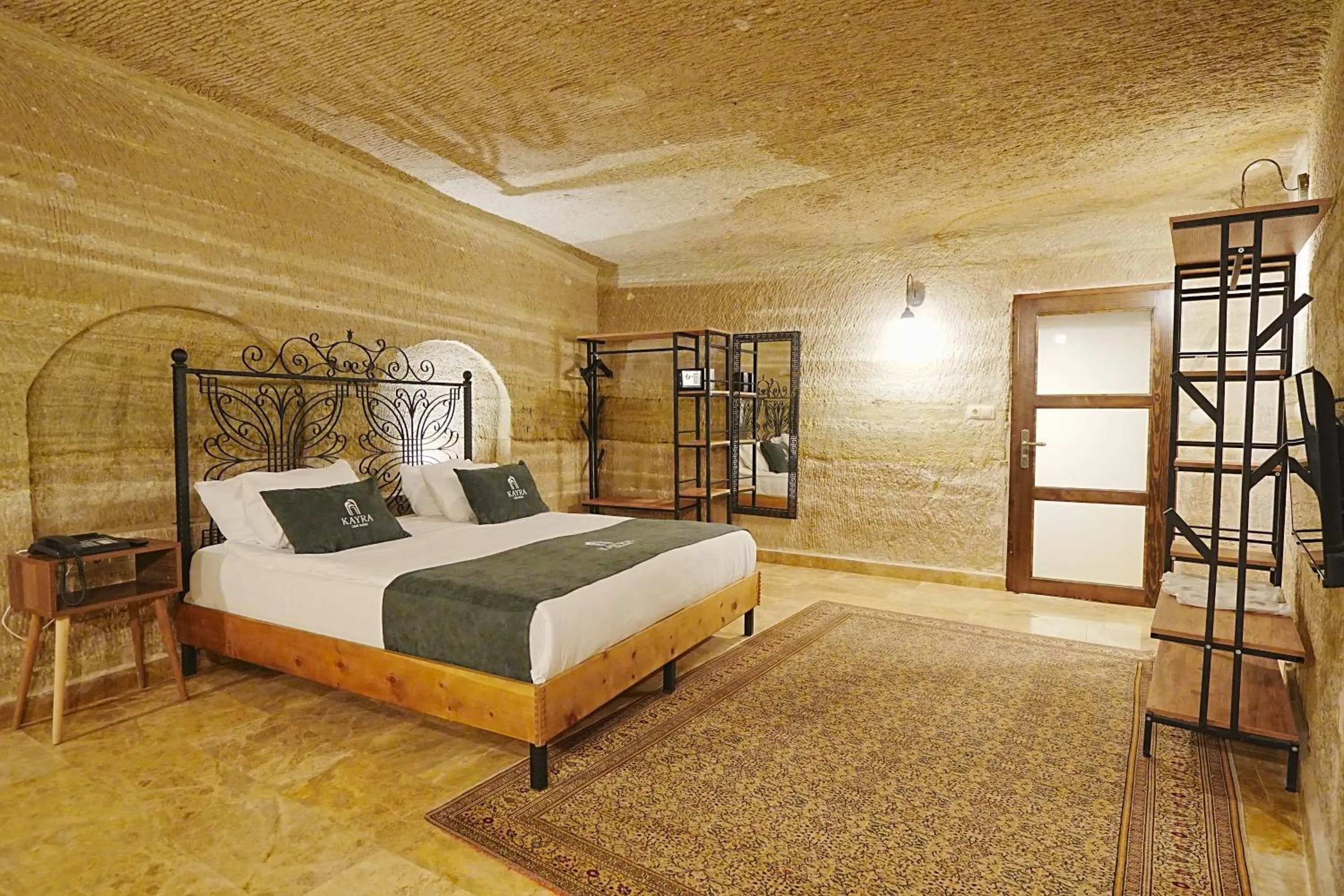 Bed in Kayra Cave Suites