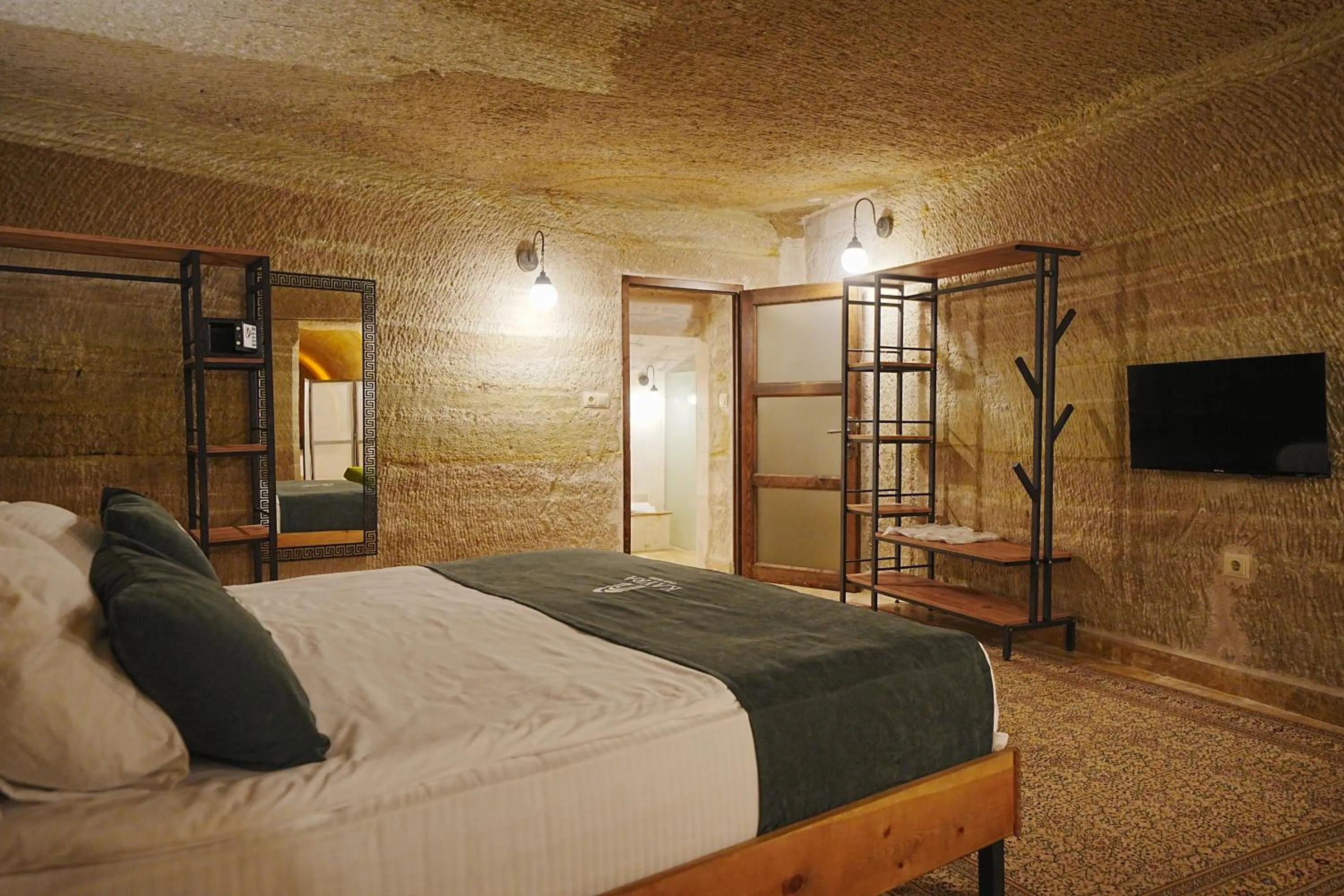 Bed in Kayra Cave Suites