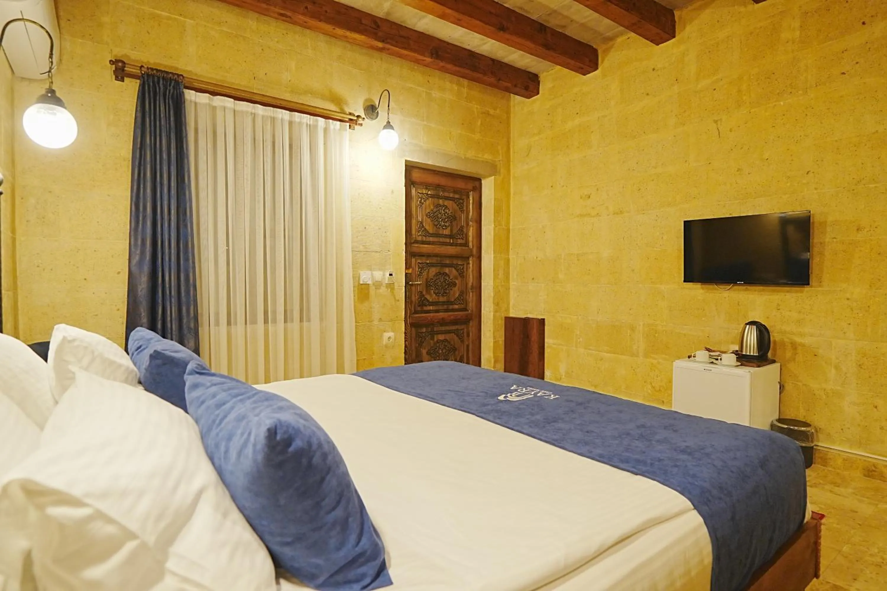 Bed in Kayra Cave Suites