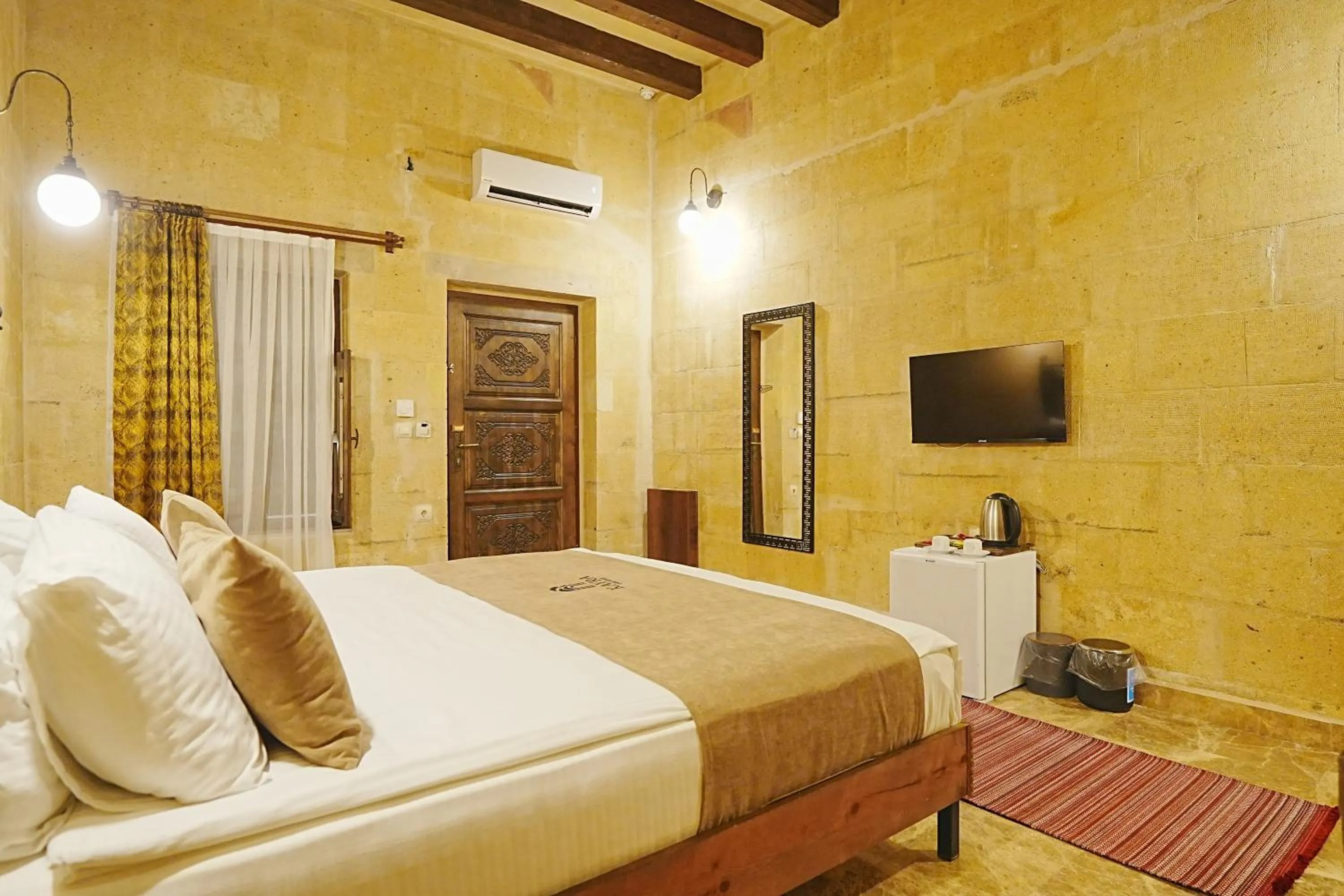 Bed in Kayra Cave Suites