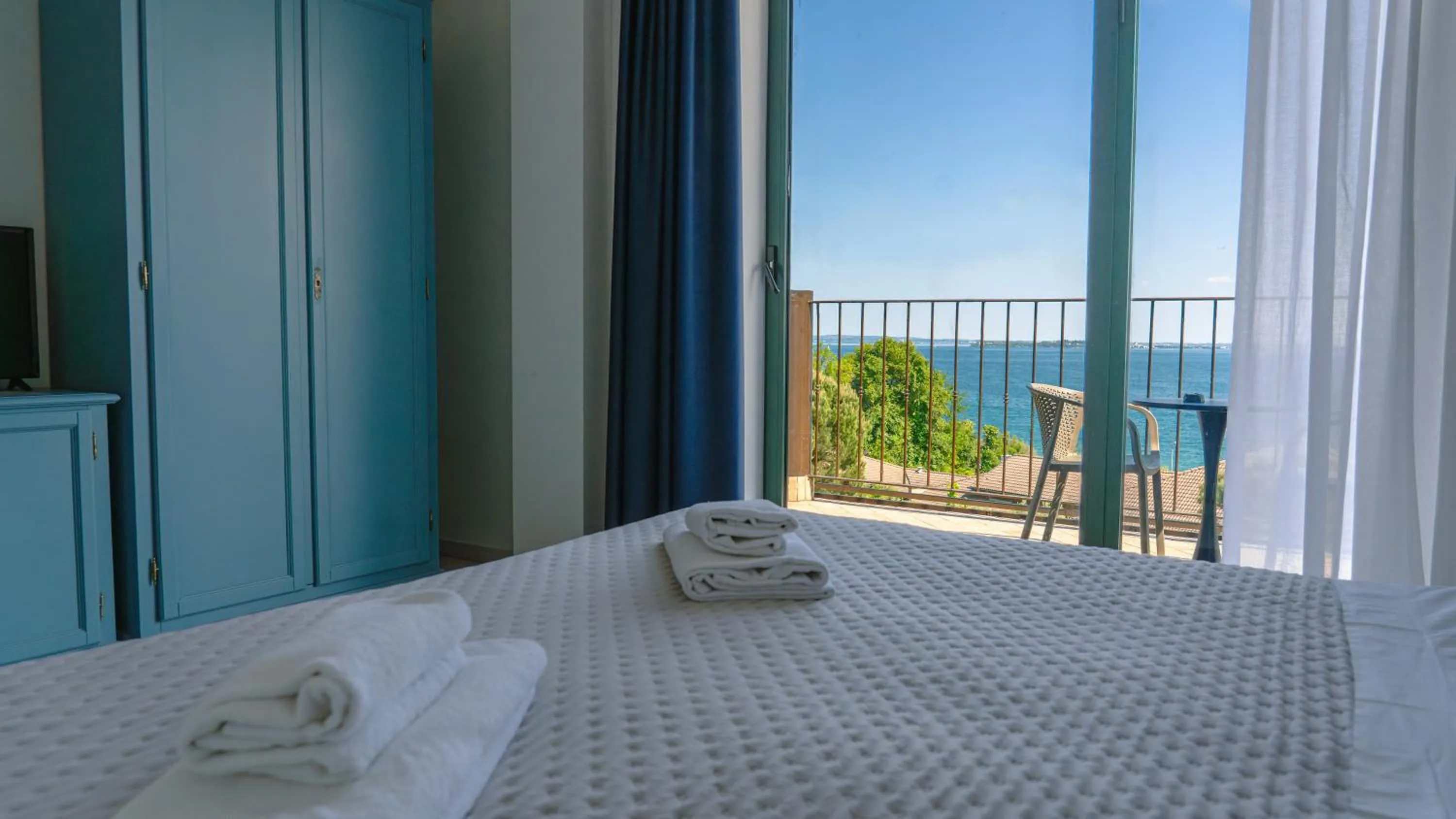 View (from property/room), Bed in AHG Riva Del Sole Hotel - Adults Only