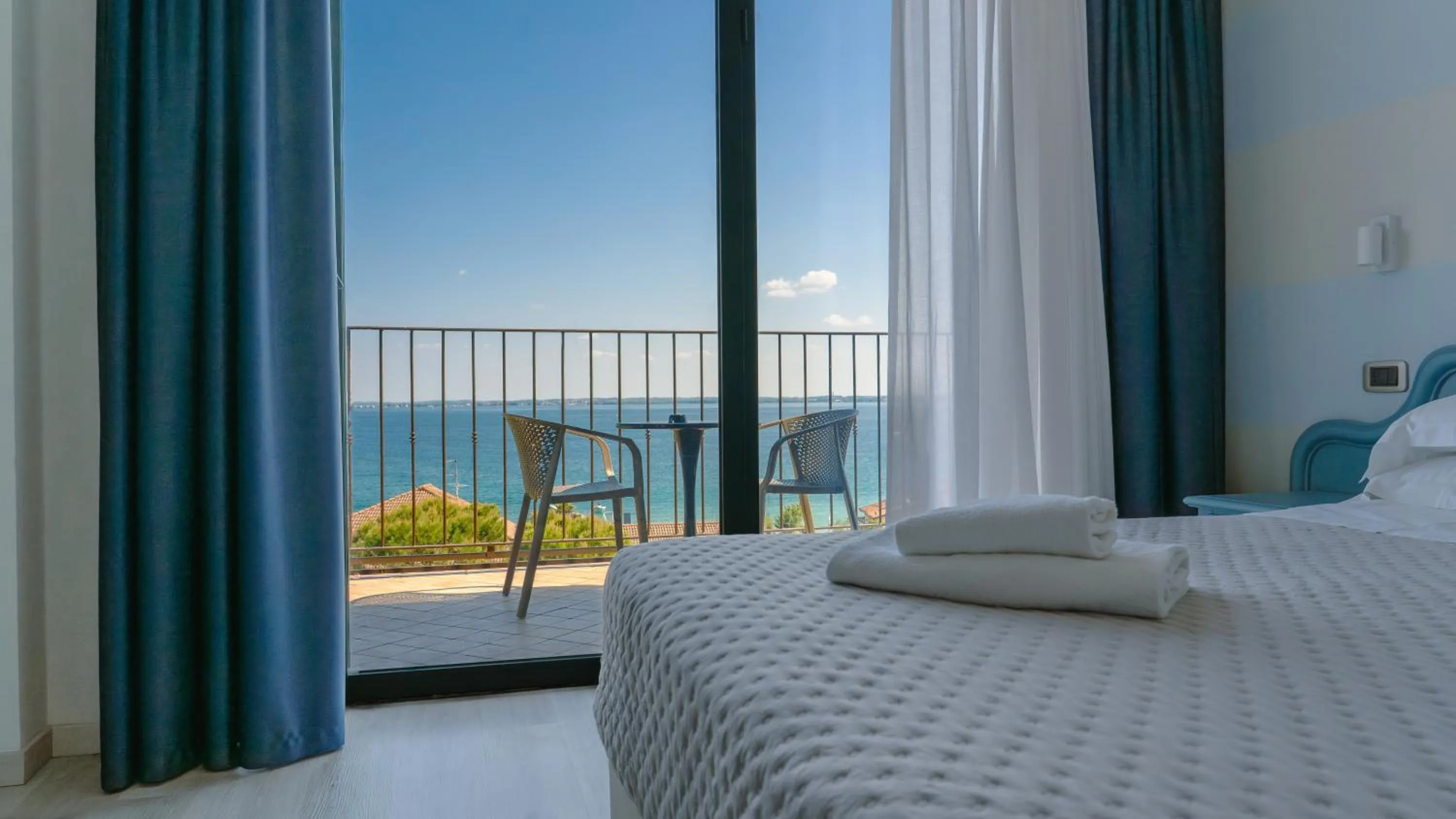 View (from property/room), Bed in AHG Riva Del Sole Hotel - Adults Only