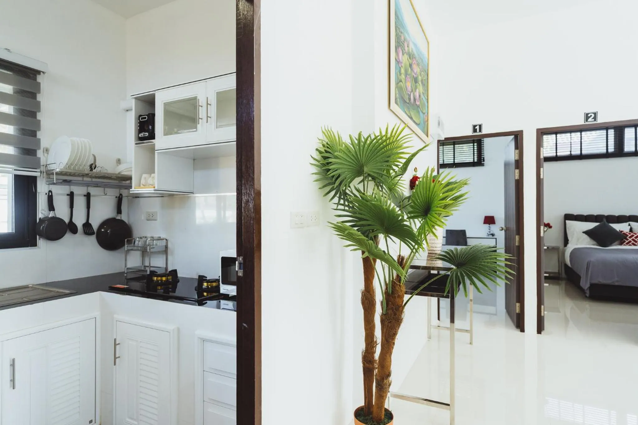 Kitchen or kitchenette, Bed in Baan Nern Khao Resort Pattaya