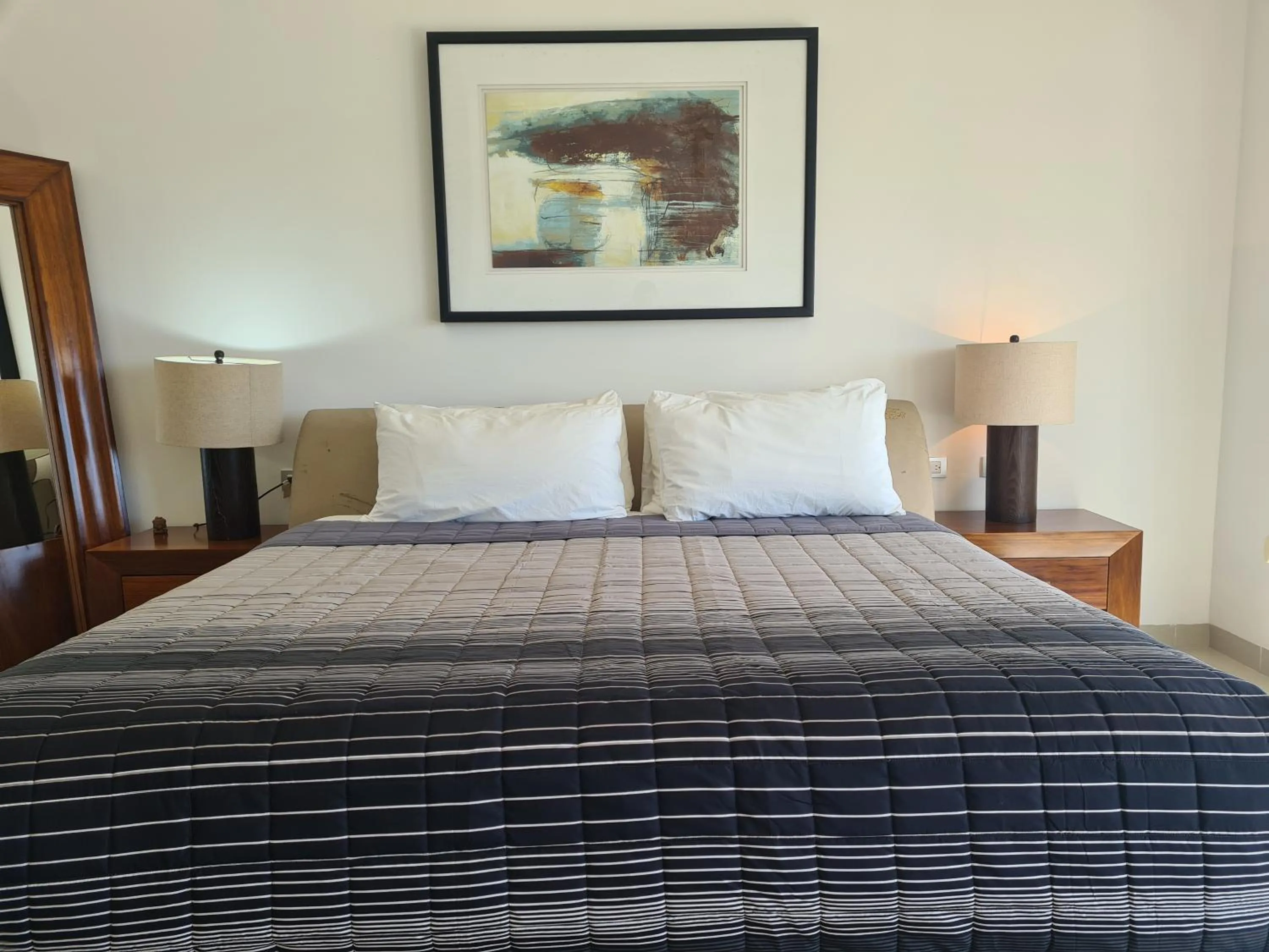 Bed in Luxury ocean view penthouse and private beach club