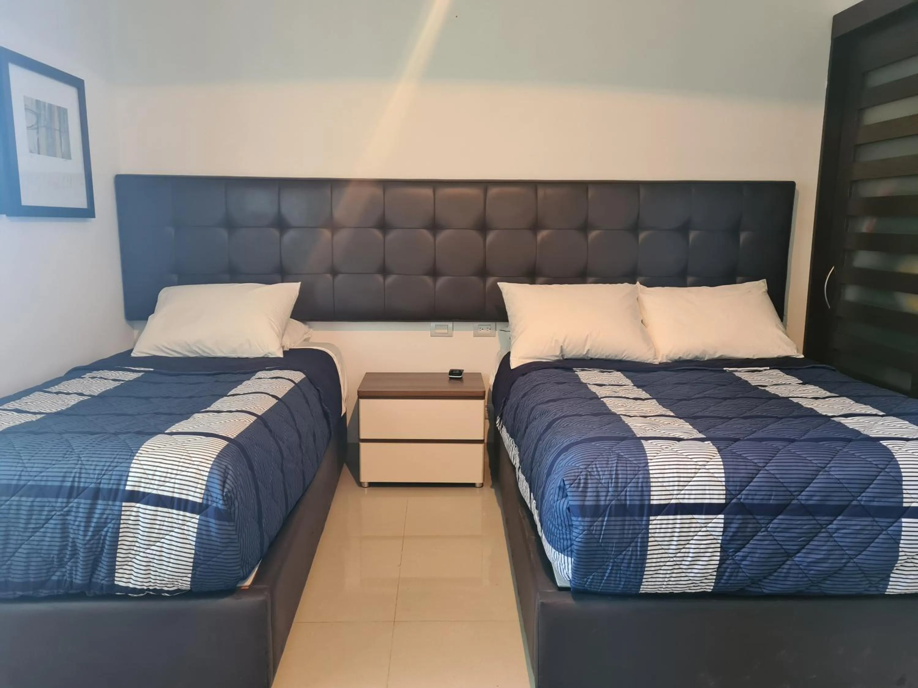 Bed in Luxury ocean view penthouse and private beach club