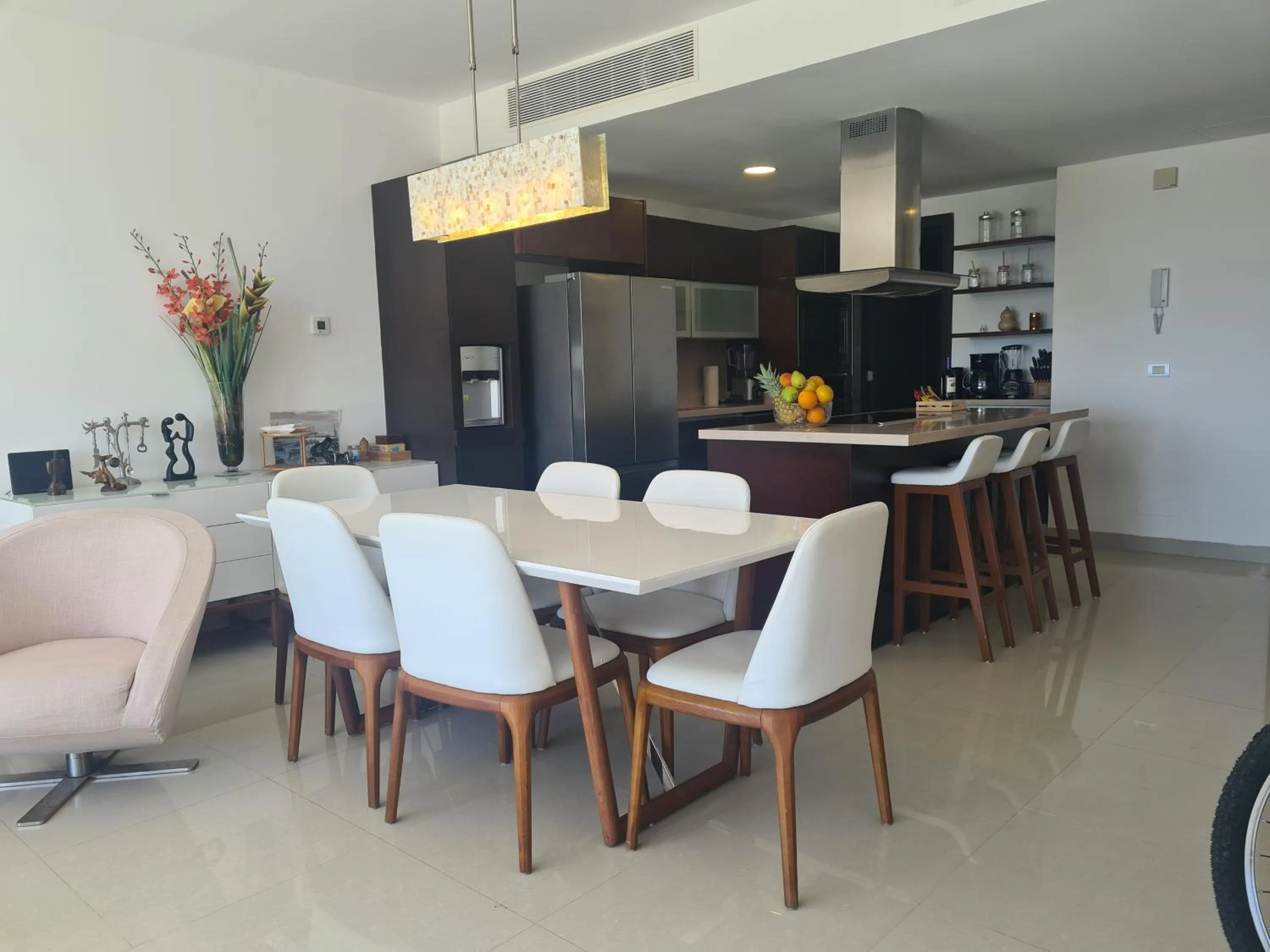 Dining area in Luxury ocean view penthouse and private beach club