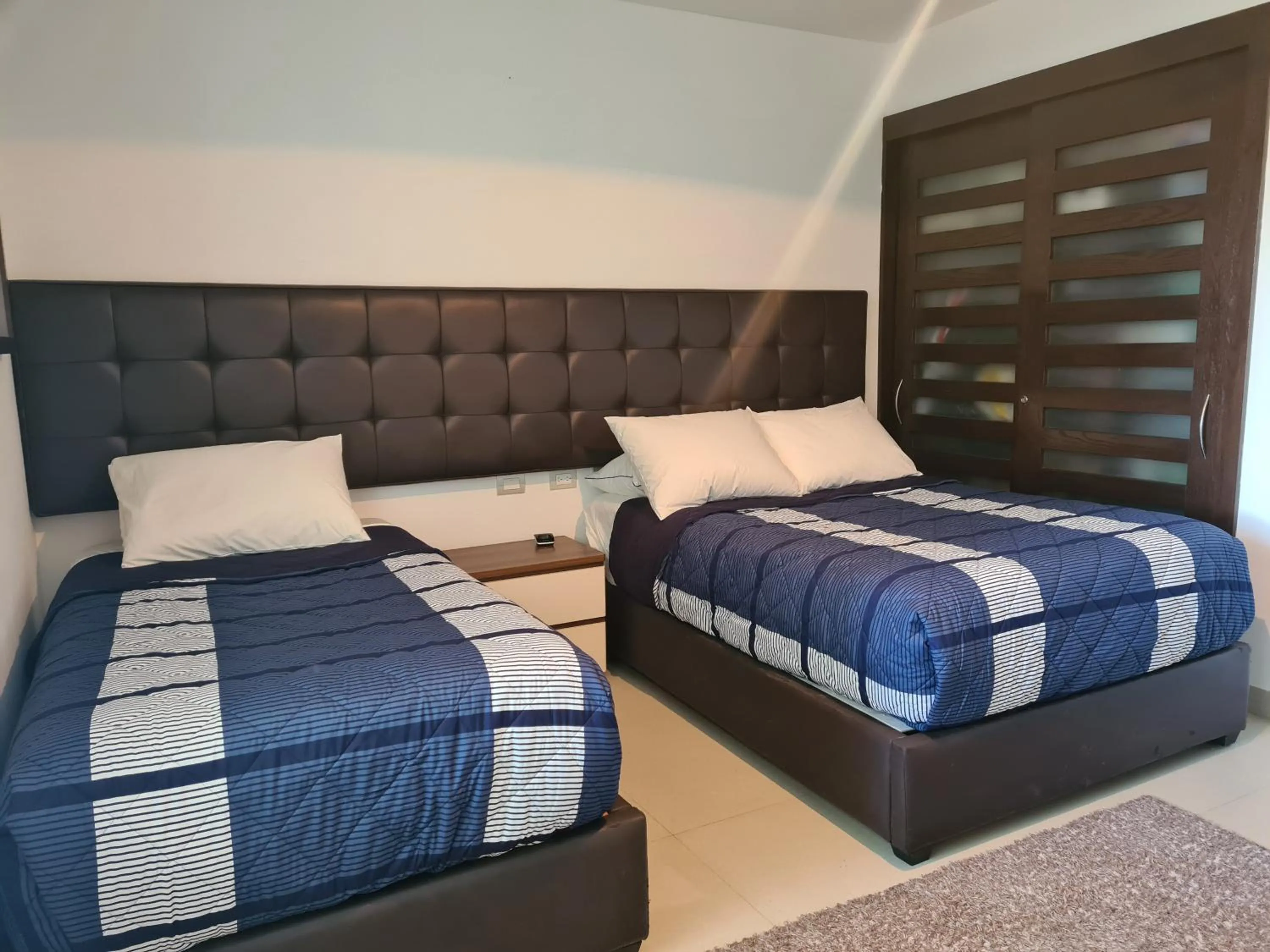 Bed in Luxury ocean view penthouse and private beach club
