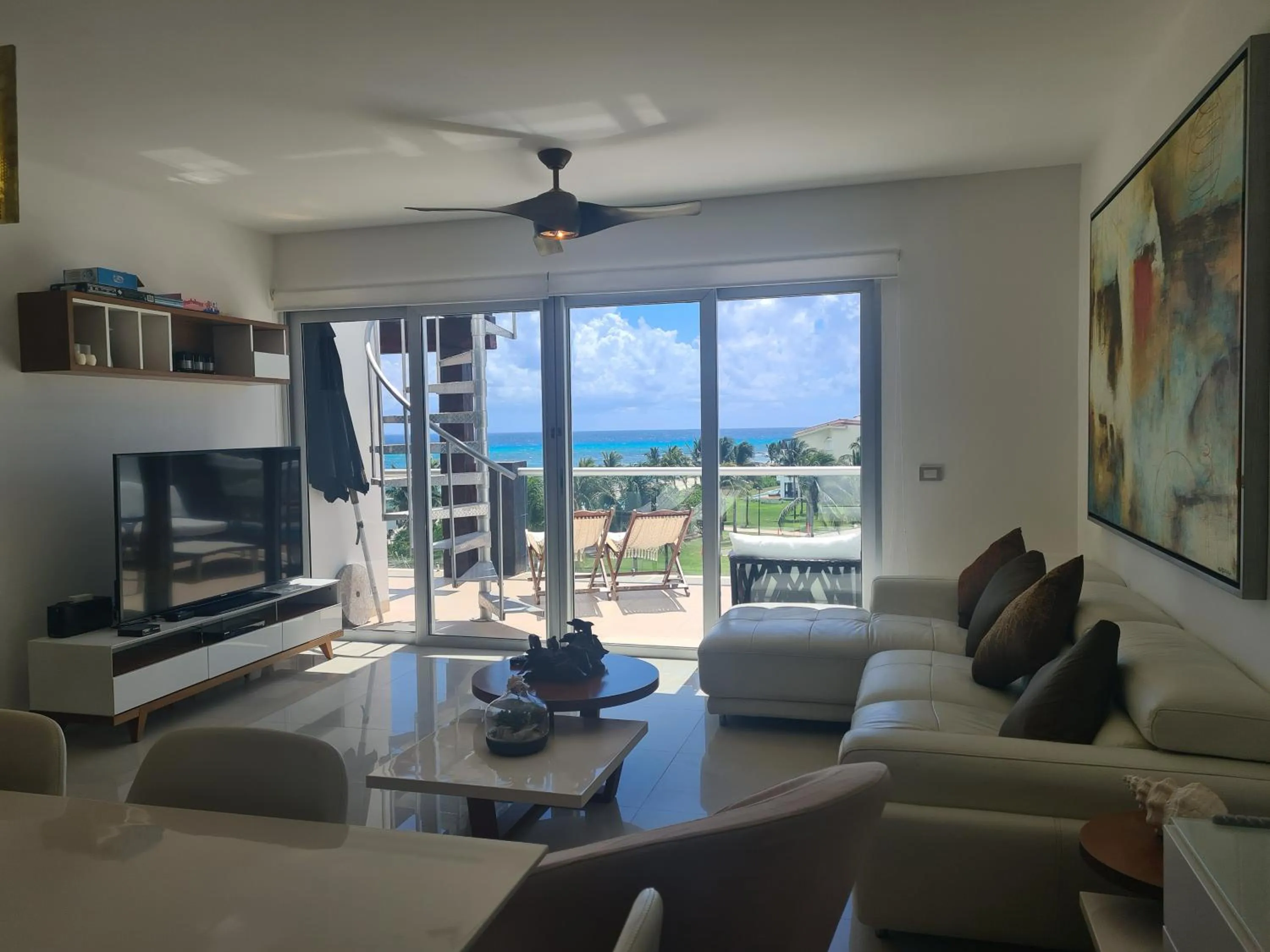 Living room in Luxury ocean view penthouse and private beach club