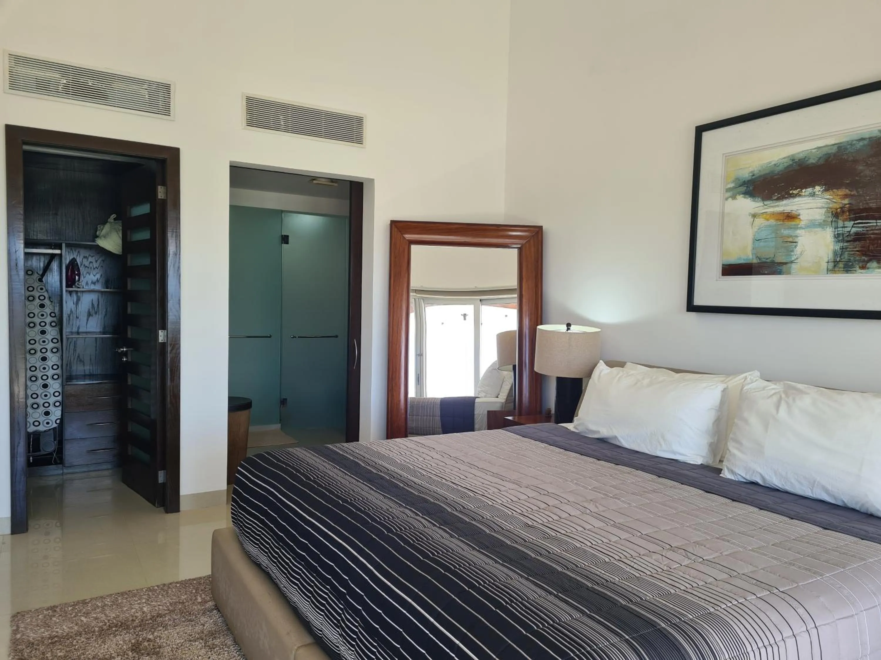 Bed in Luxury ocean view penthouse and private beach club