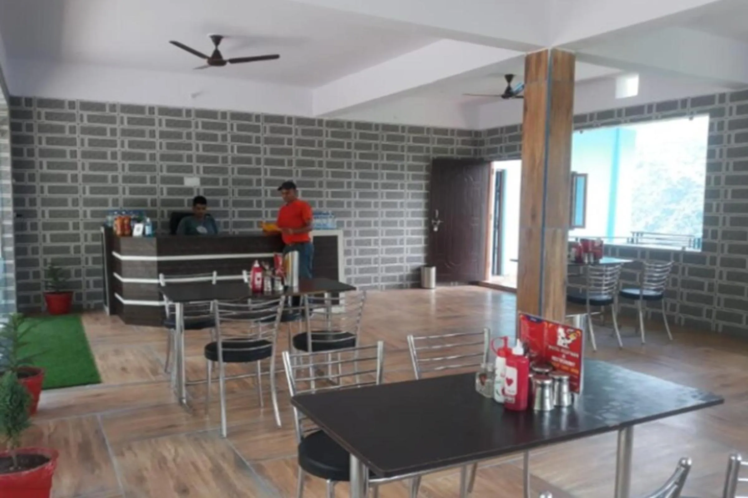 Seating area in HOTEL PUSPWAN AND RESTAURANT by StayApart