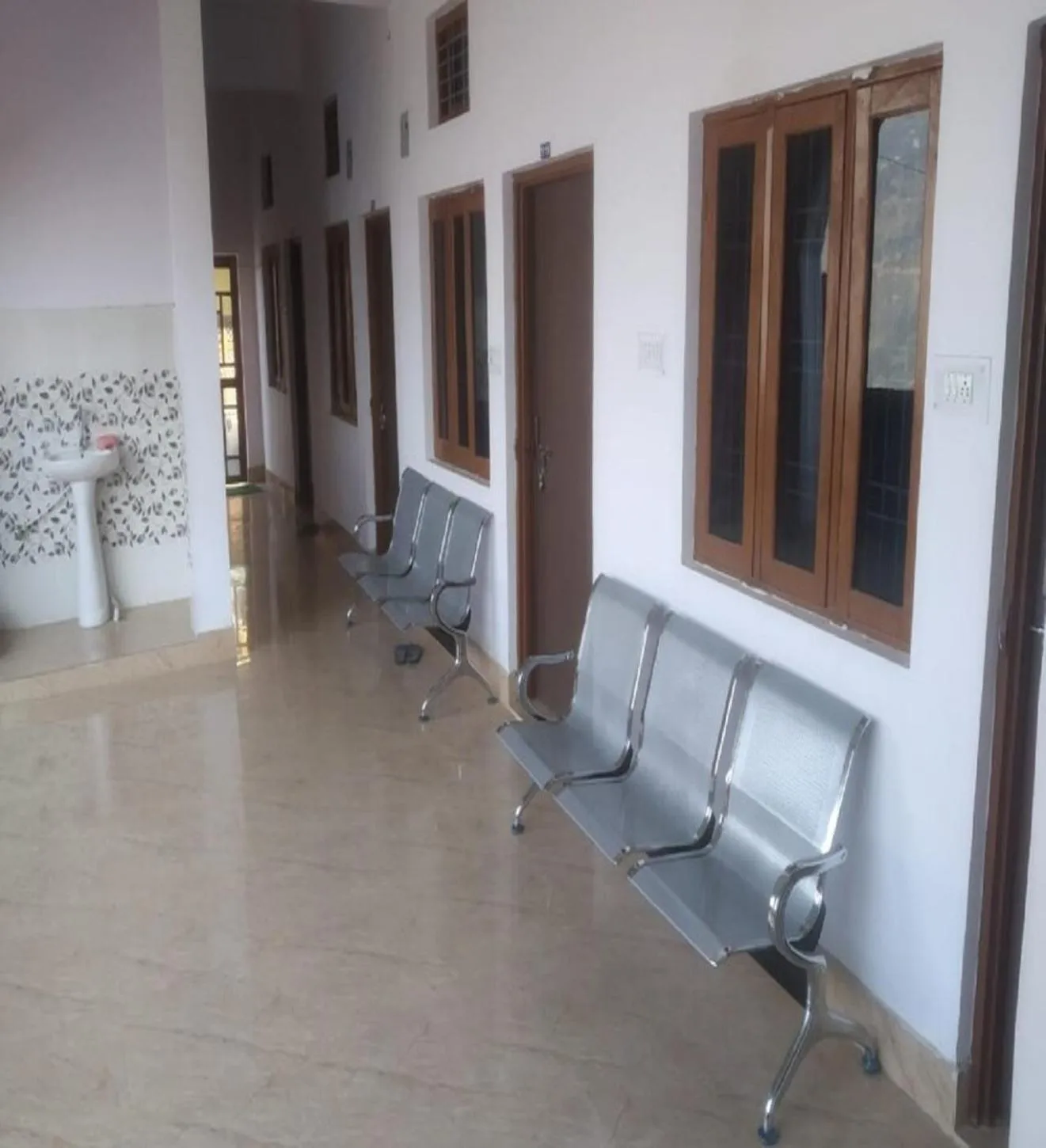 Seating area in HOTEL PUSPWAN AND RESTAURANT by StayApart