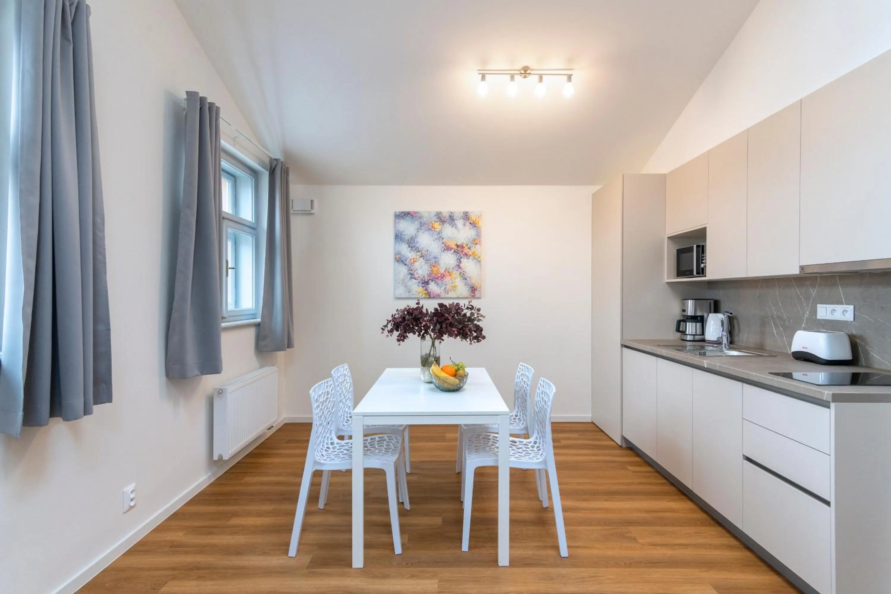 Dining area in Hidden Art Boutique Residence by Dwellfort