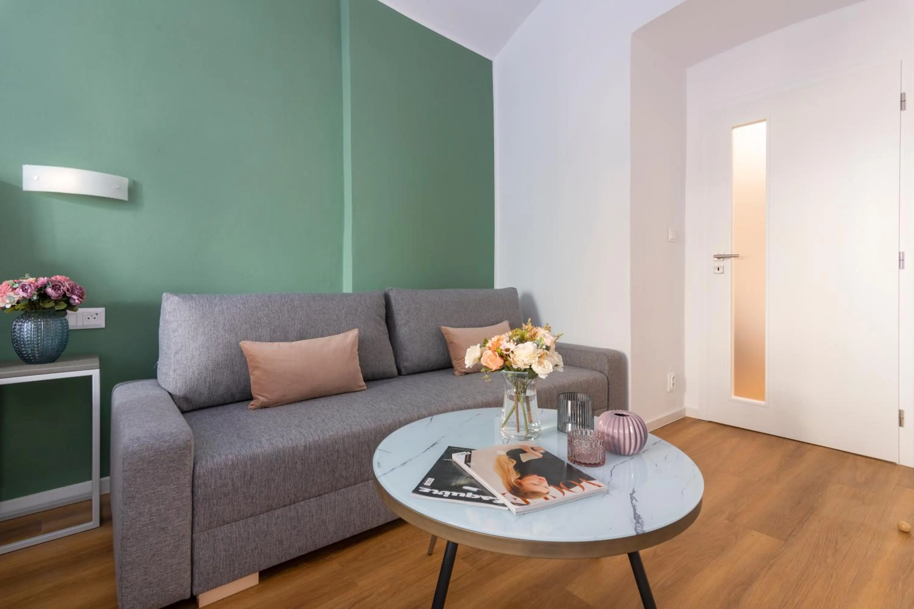 Seating area in Hidden Art Boutique Residence by Dwellfort