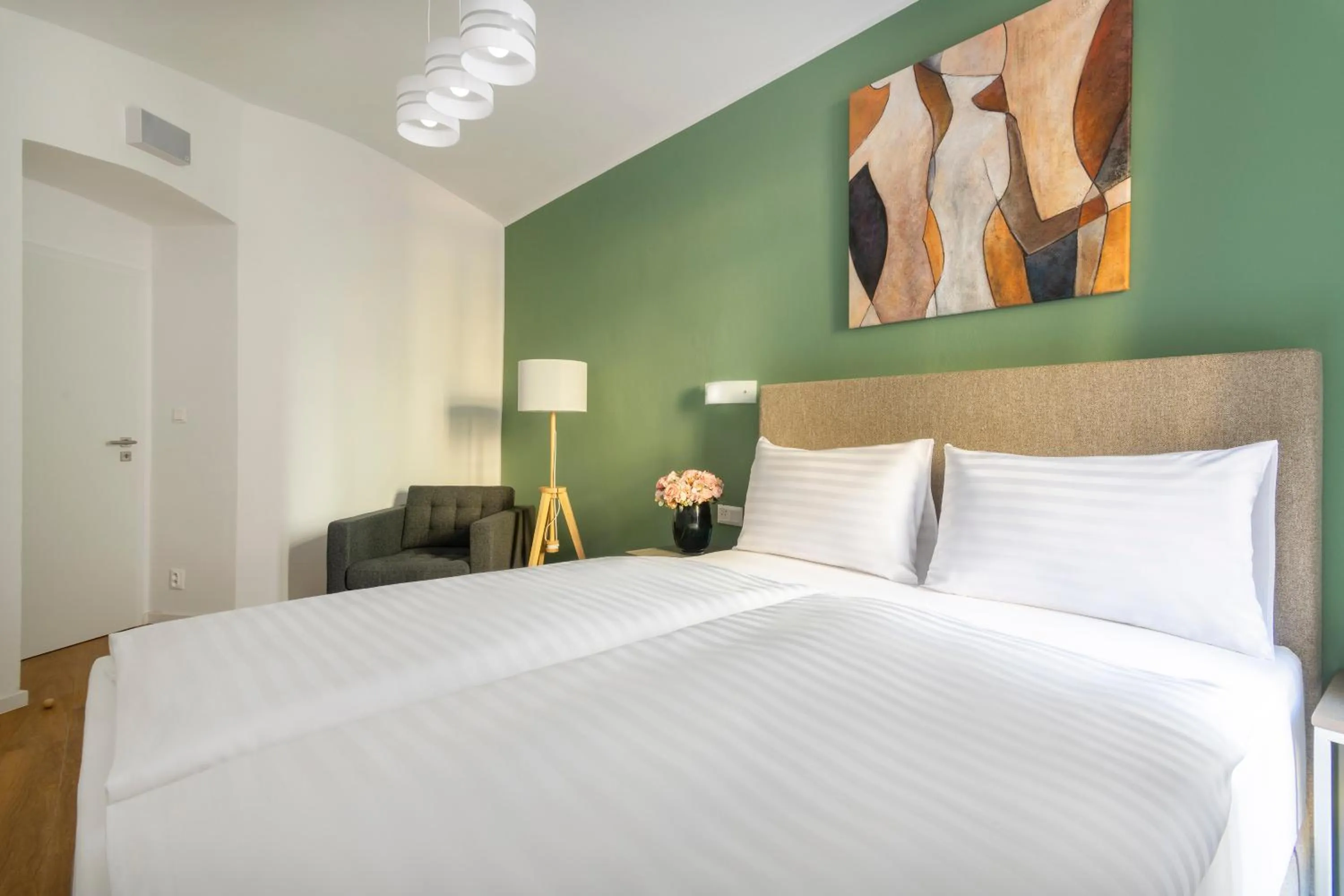 Bed in Hidden Art Boutique Residence by Dwellfort