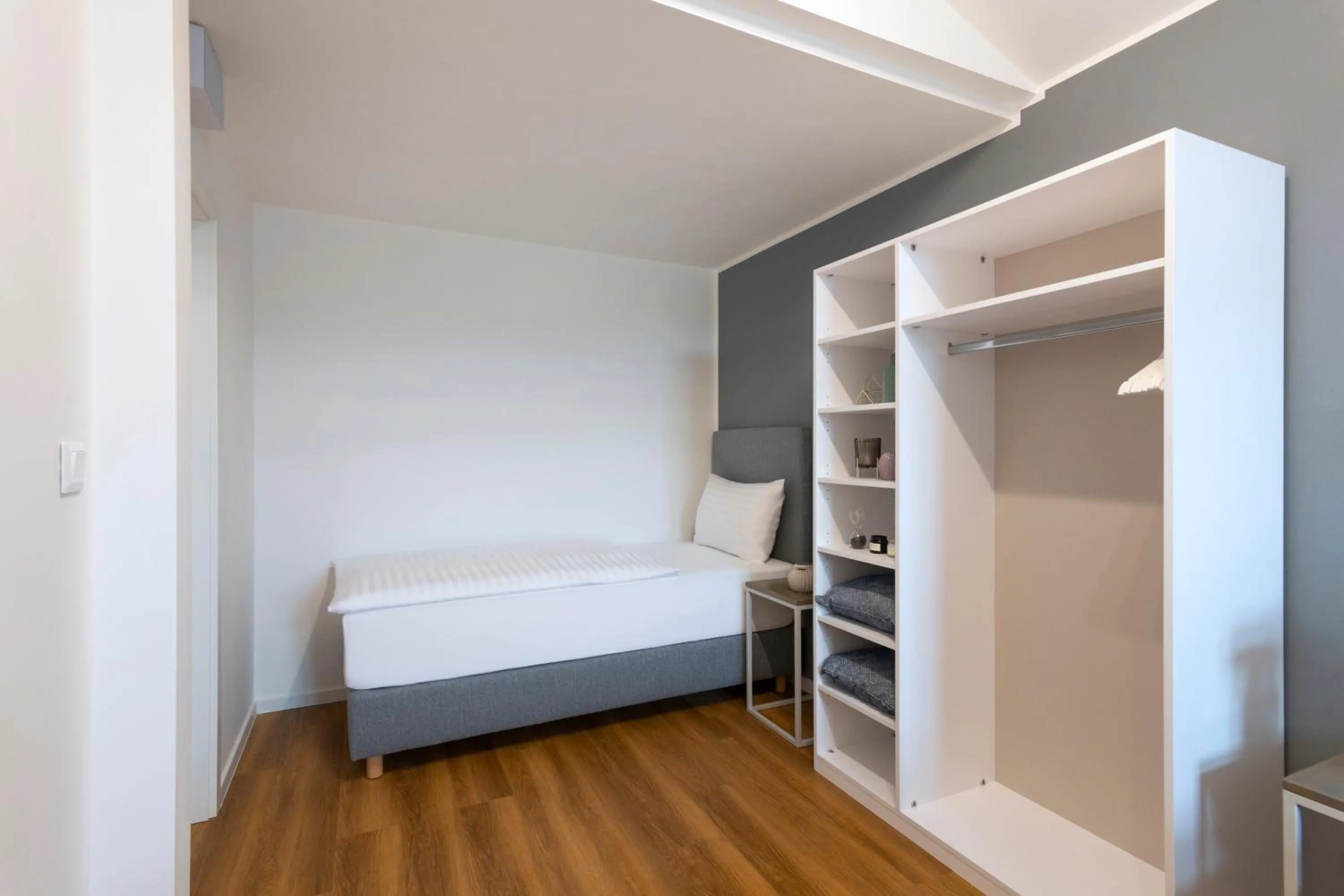 Bed in Hidden Art Boutique Residence by Dwellfort