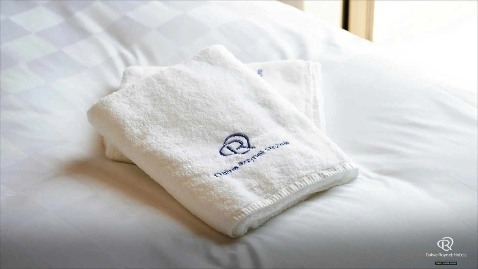 towels, Bed in Daiwa Roynet Hotel Kagoshima Tenmonkan PREMIER - former Daiwa Roynet Hotel Kagoshima Tenmonkan