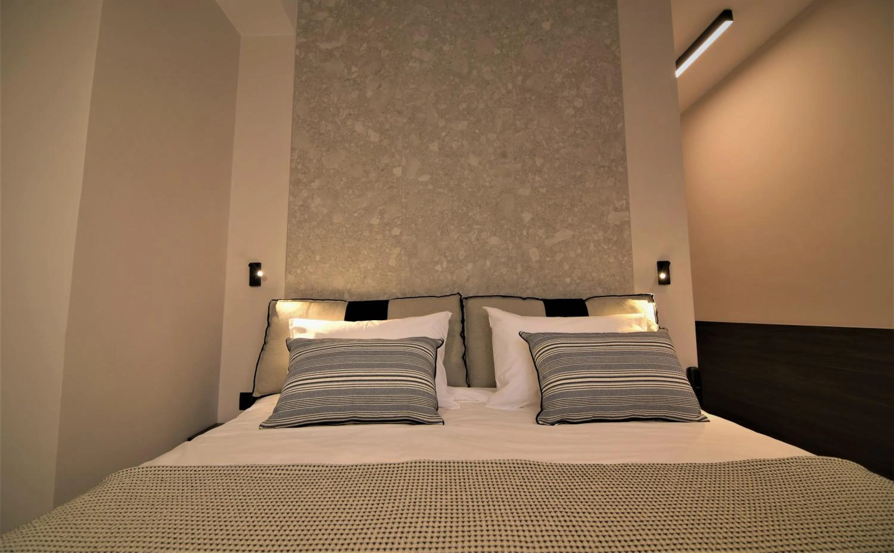 Bed in Cityzoe Athens Suites