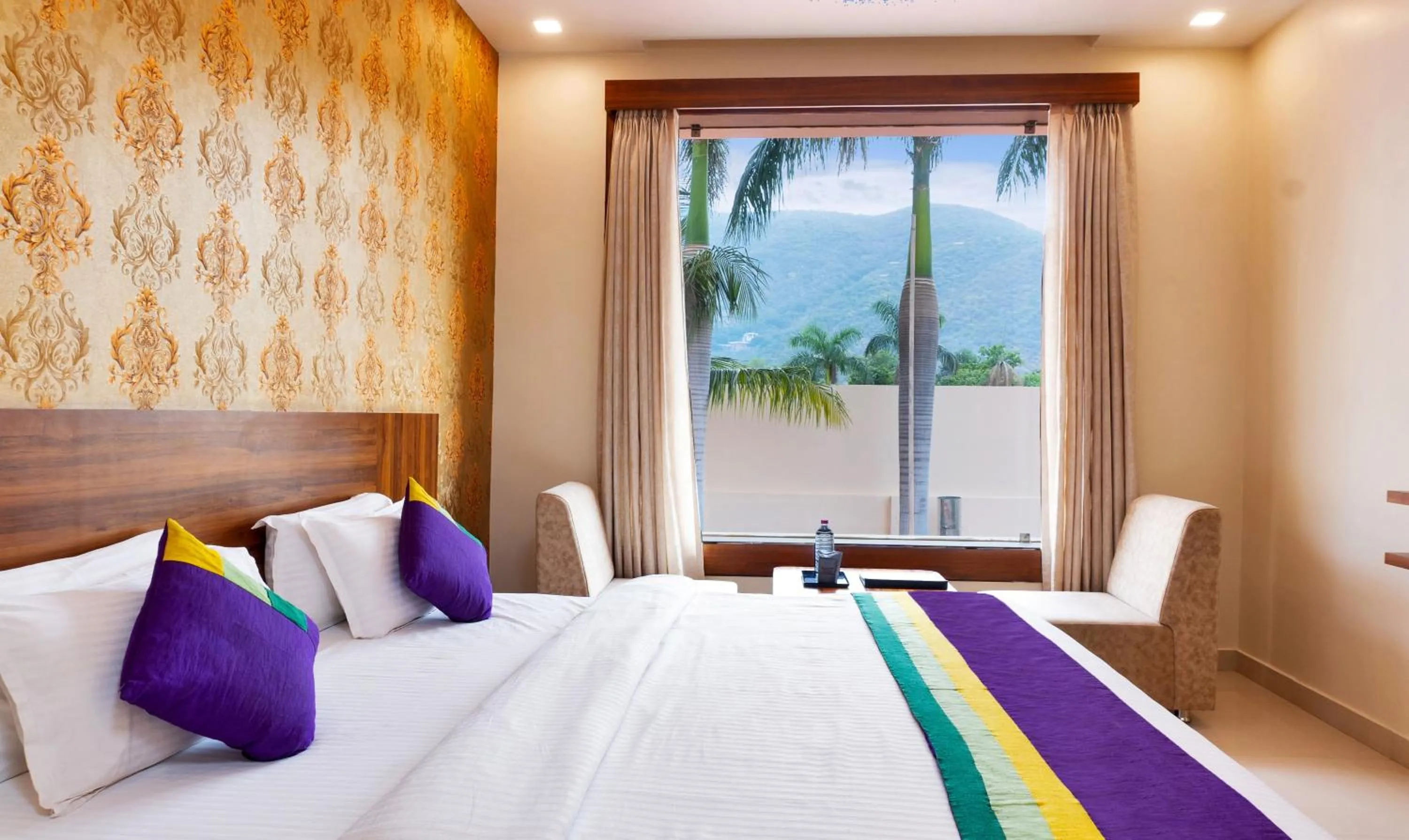 Bedroom, Bed in Treebo Premium Royal Amar With Mountain View and Swimming Pool