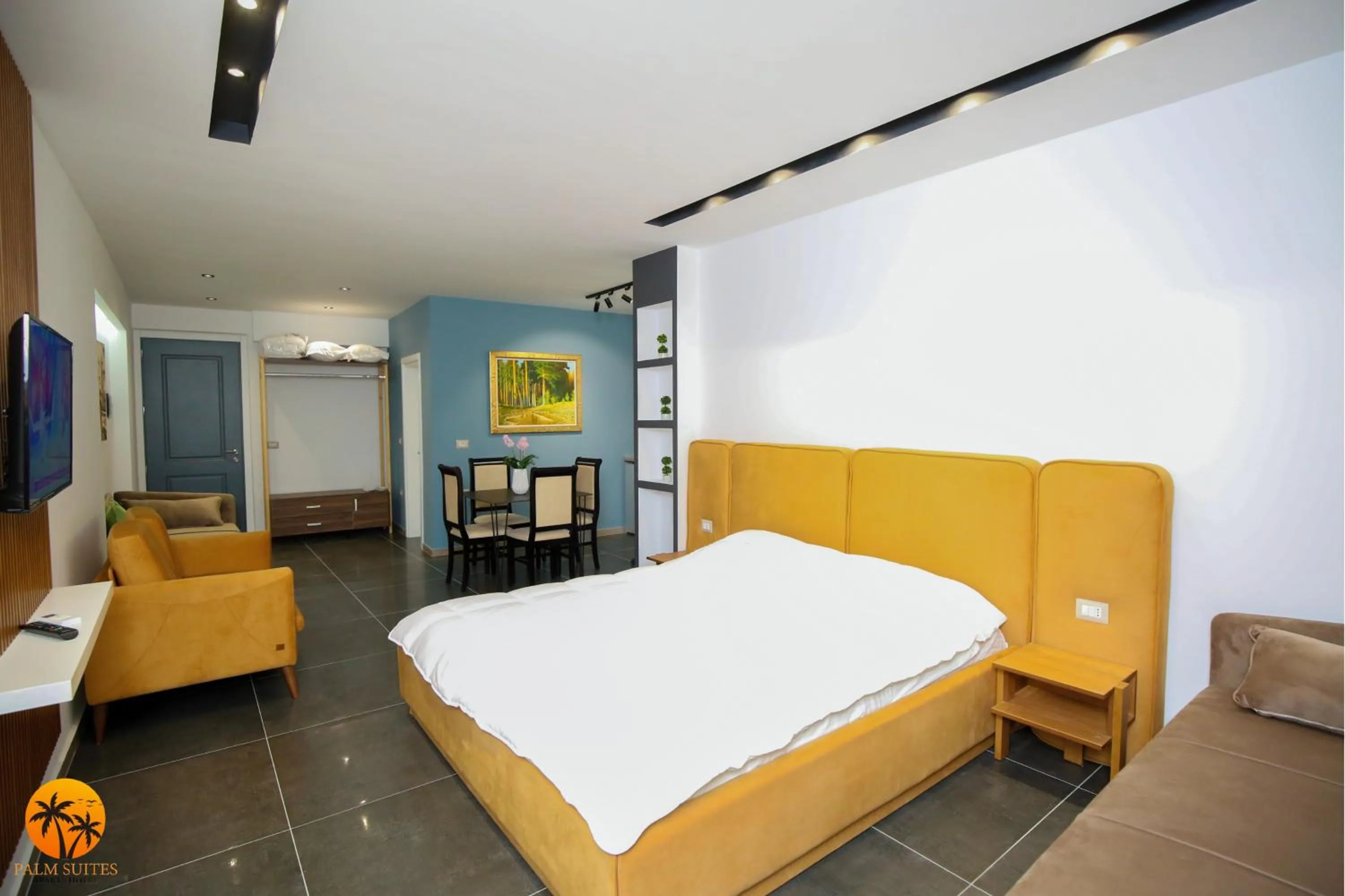 Bed in Palm Suites Apartment-Suite