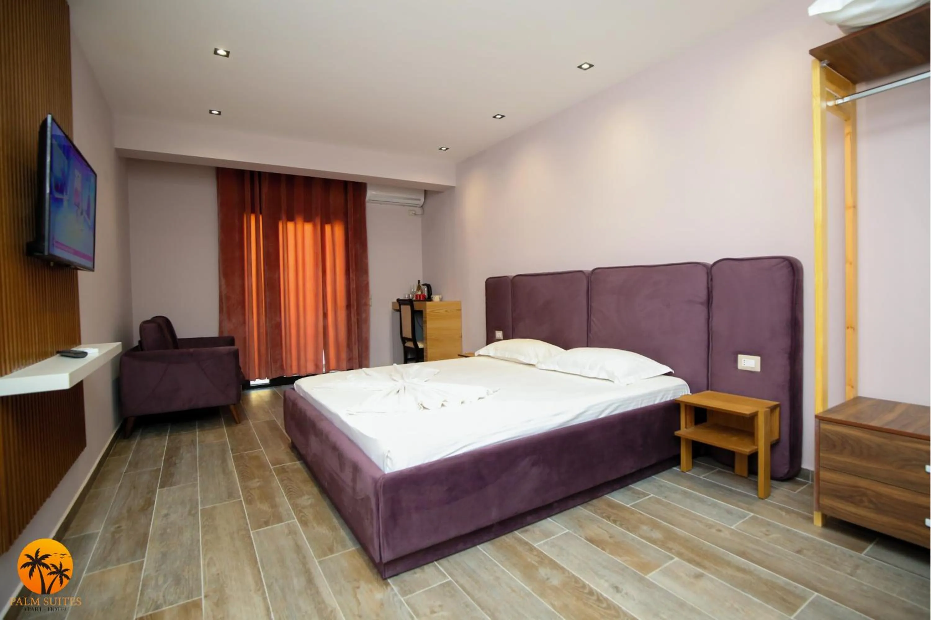 Bed in Palm Suites Apartment-Suite