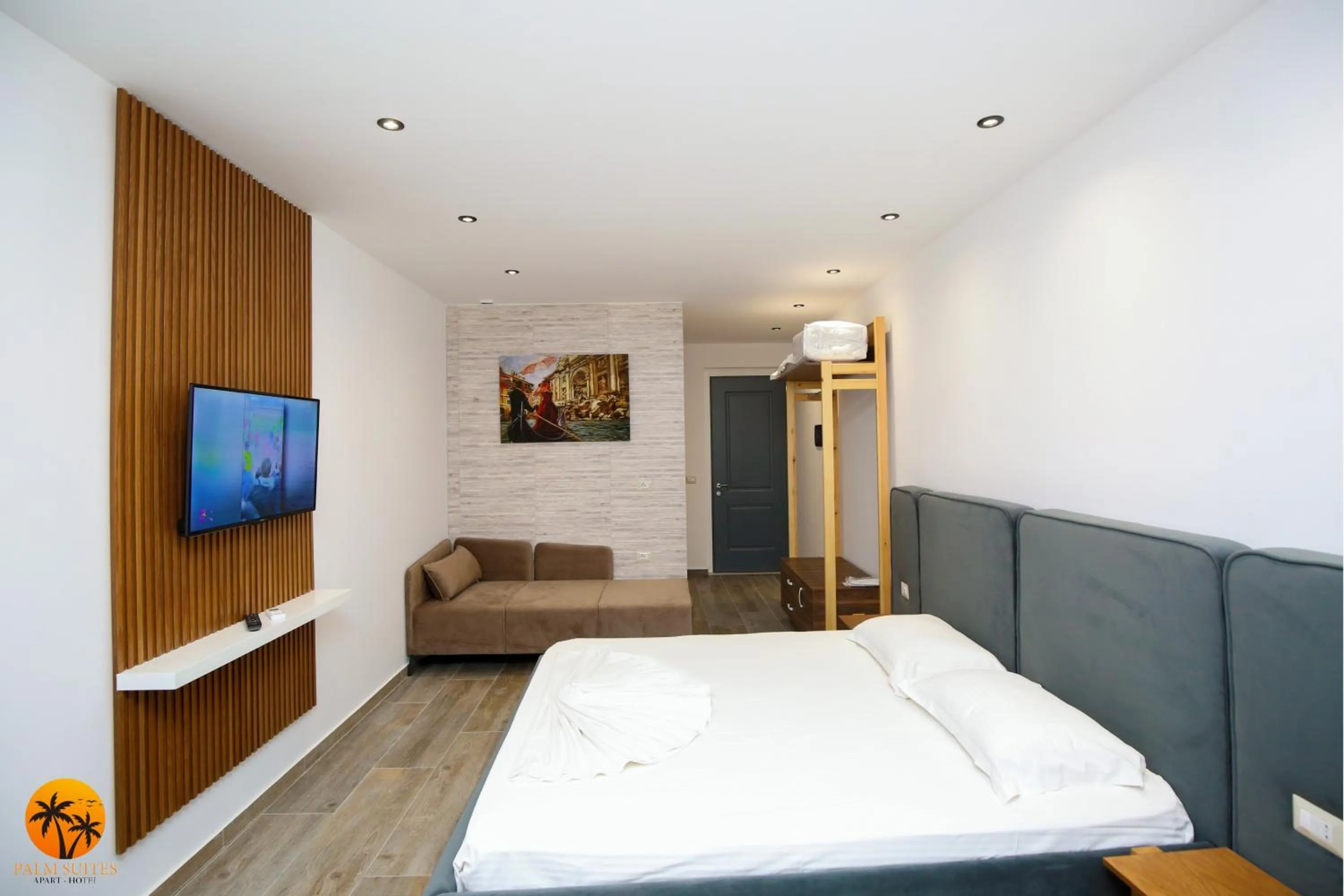 Bed in Palm Suites Apartment-Suite