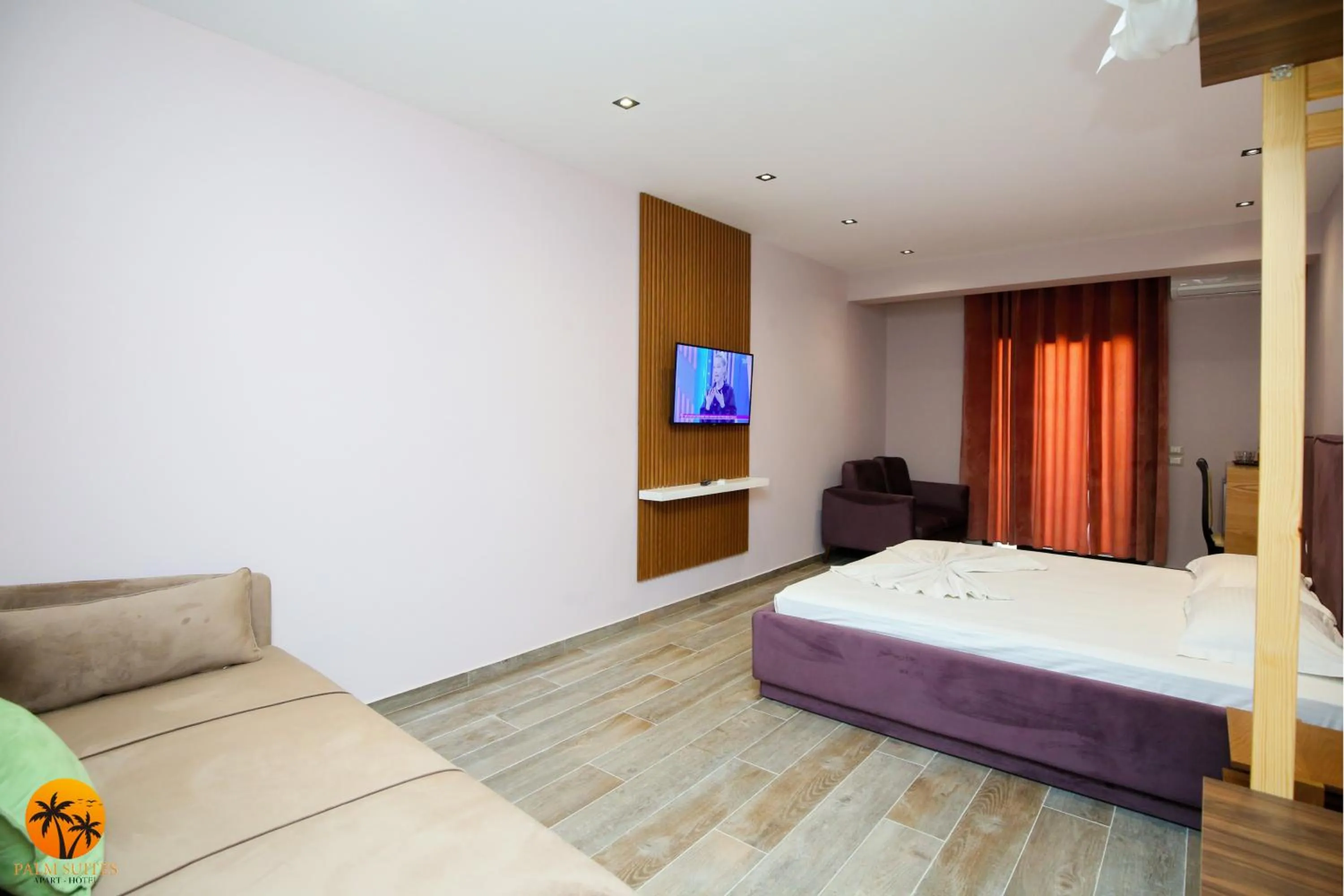 Bed in Palm Suites Apartment-Suite