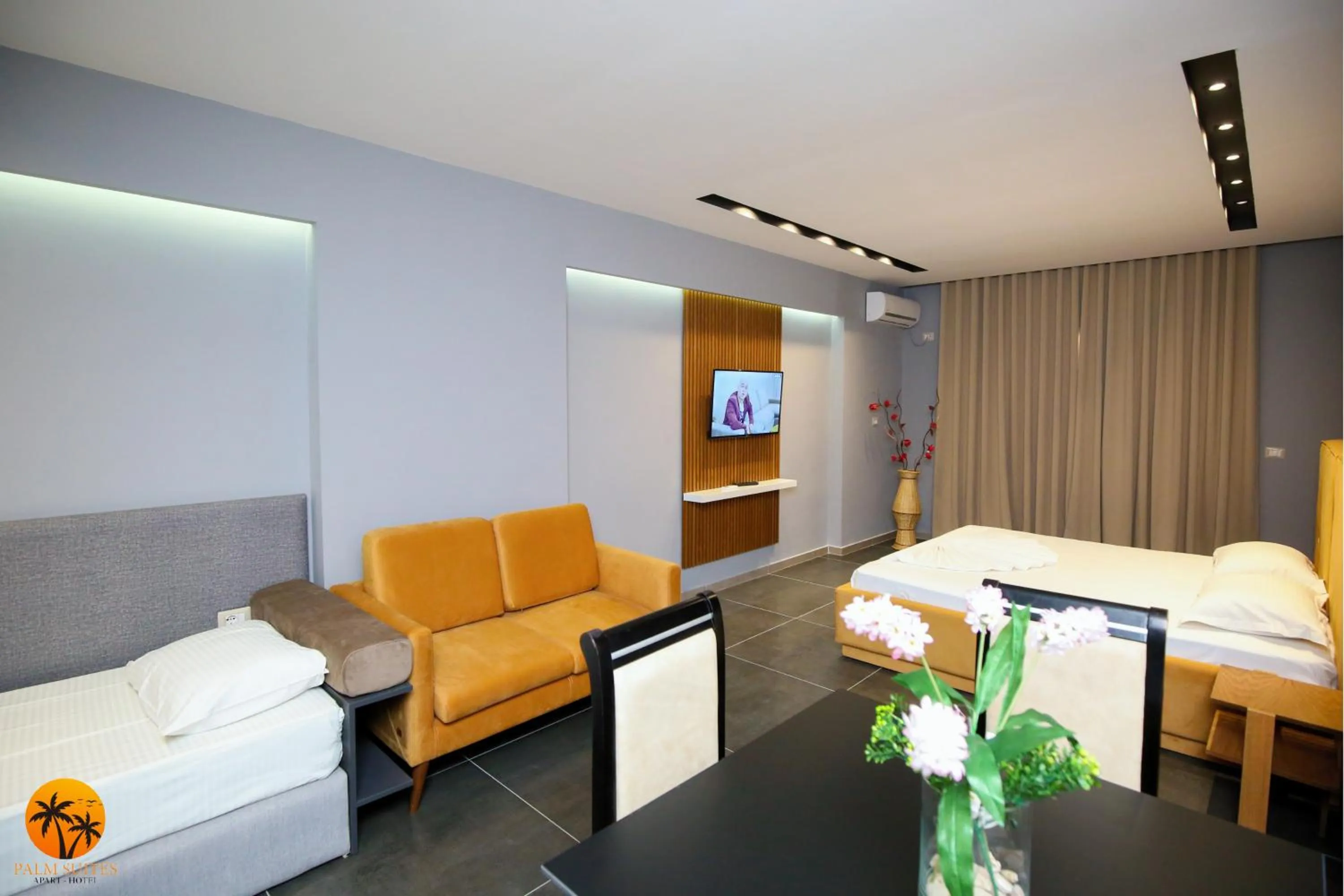 Bed in Palm Suites Apartment-Suite