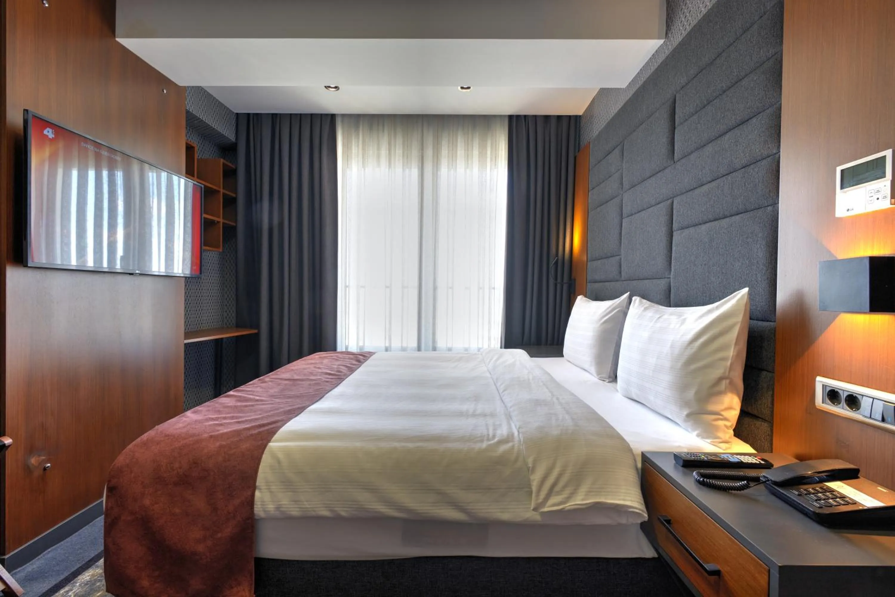 Bed in Nova Vista Deluxe & Suites a Member of Radisson Individuals