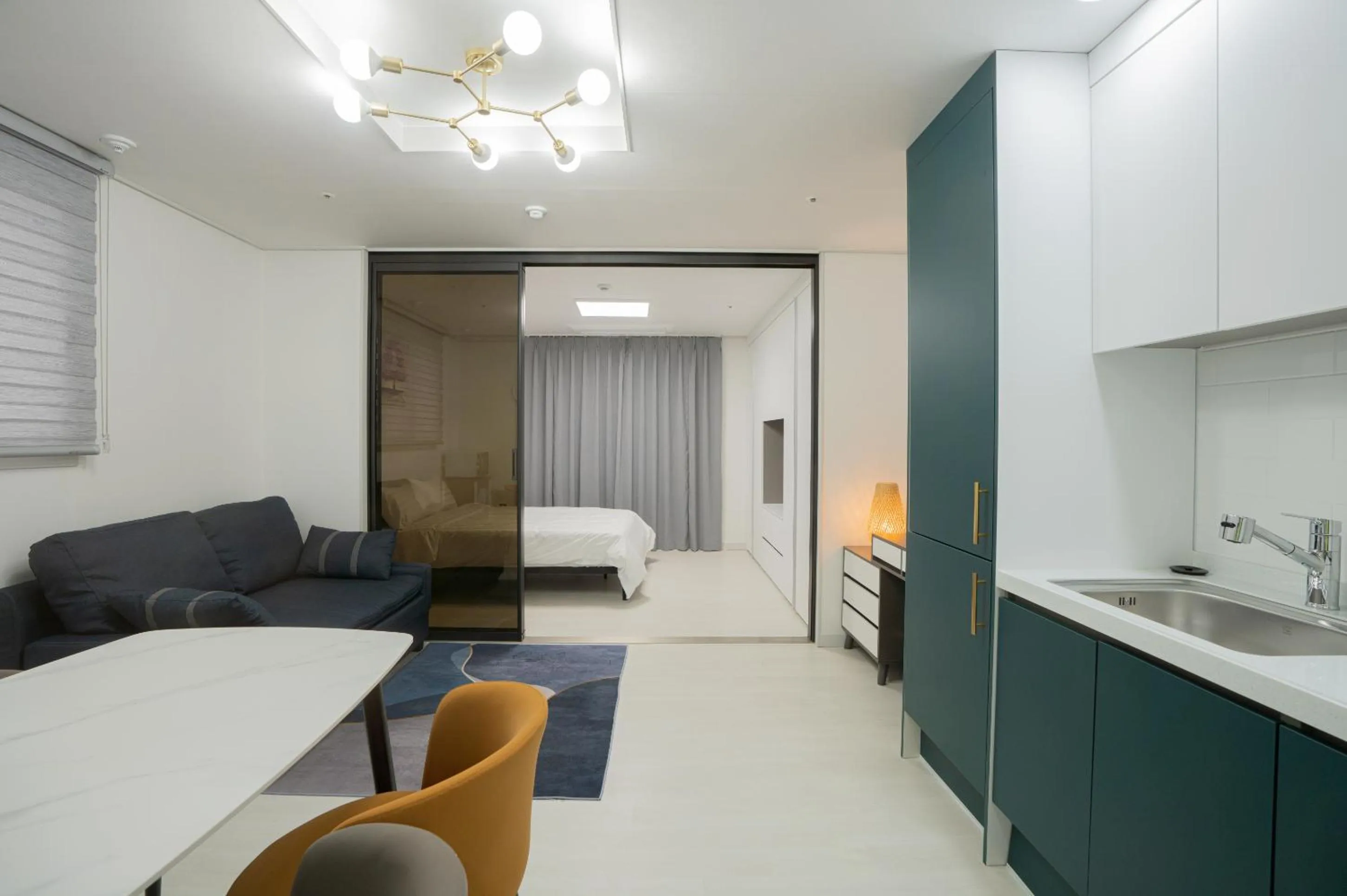 Bed in Jeju Seomun Residence Hotel