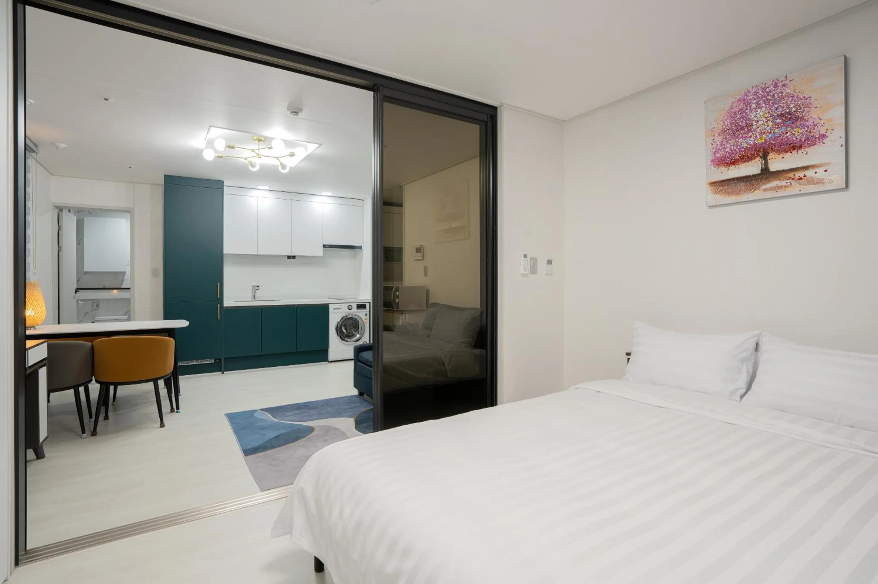 Bed in Jeju Seomun Residence Hotel