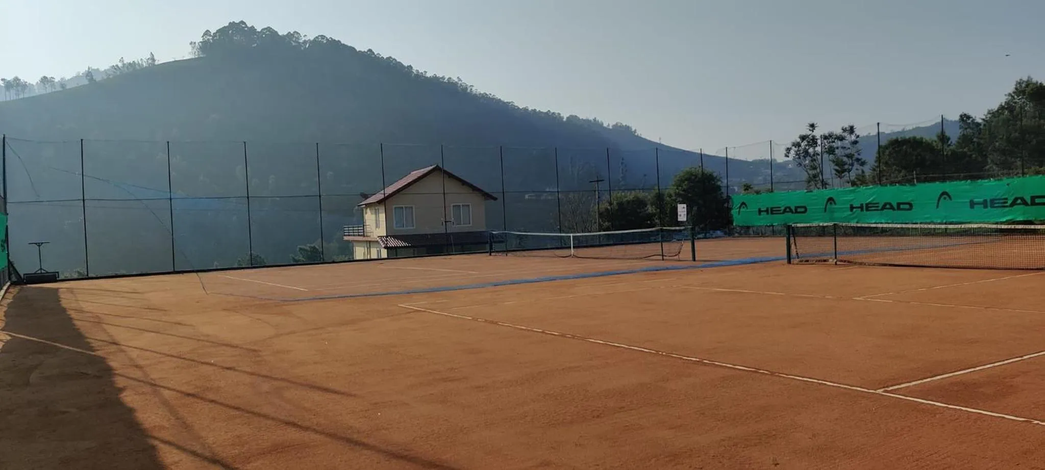 Tennis court in Rosewood by Nature Resorts and Stays